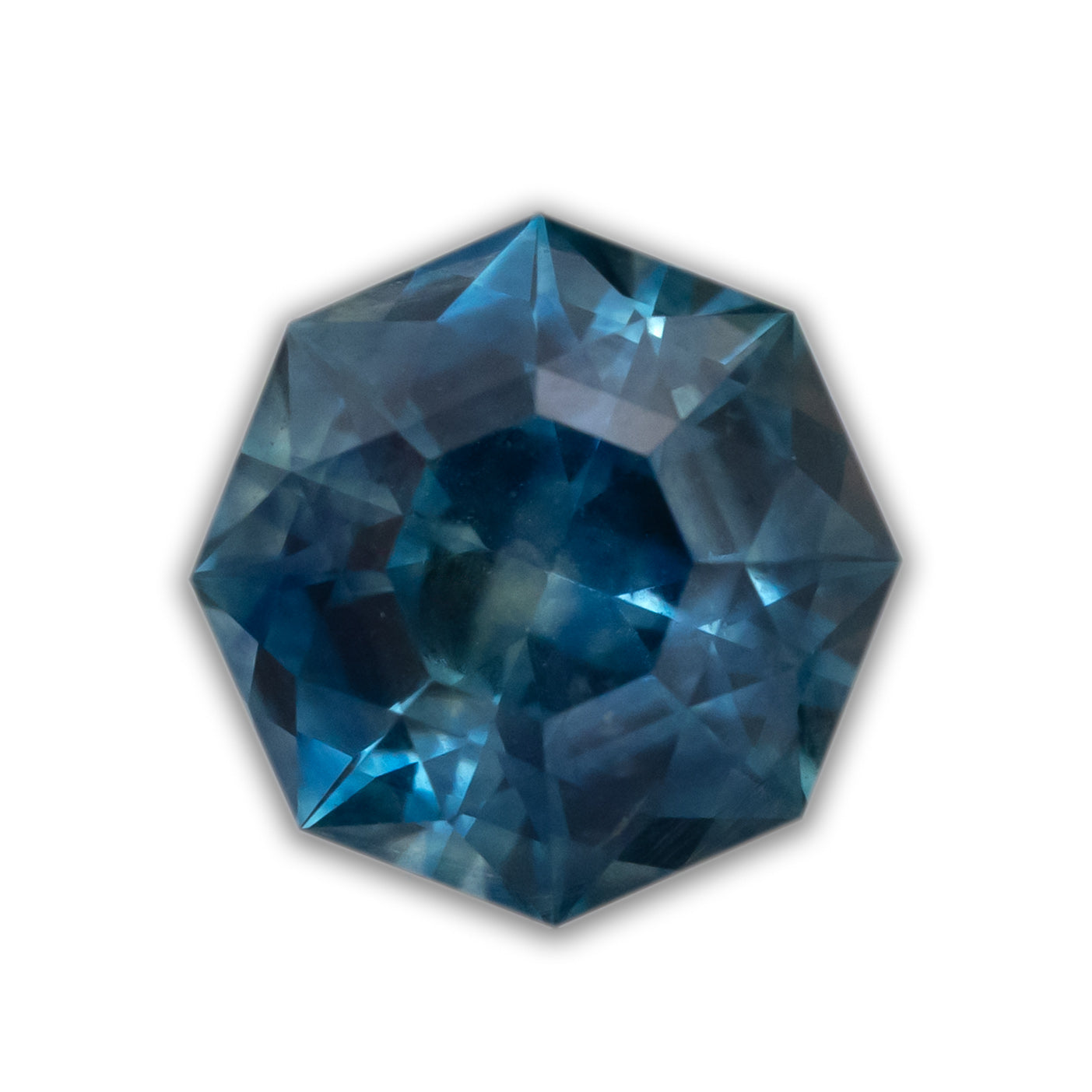 An octagon cut blue sapphire on a white background