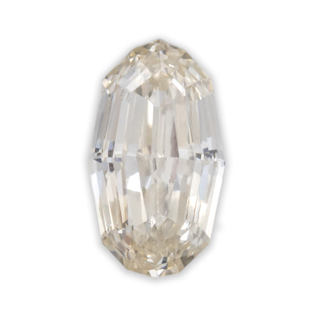 An oval cut champagne diamond on a white background