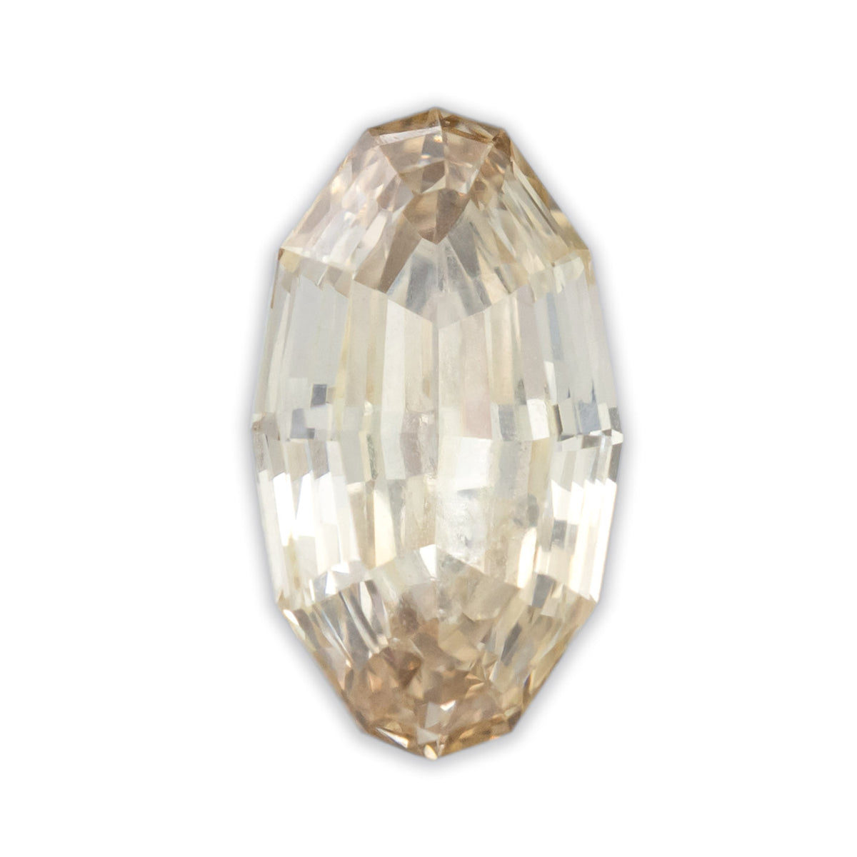A moval cut champagne diamond on a white background
