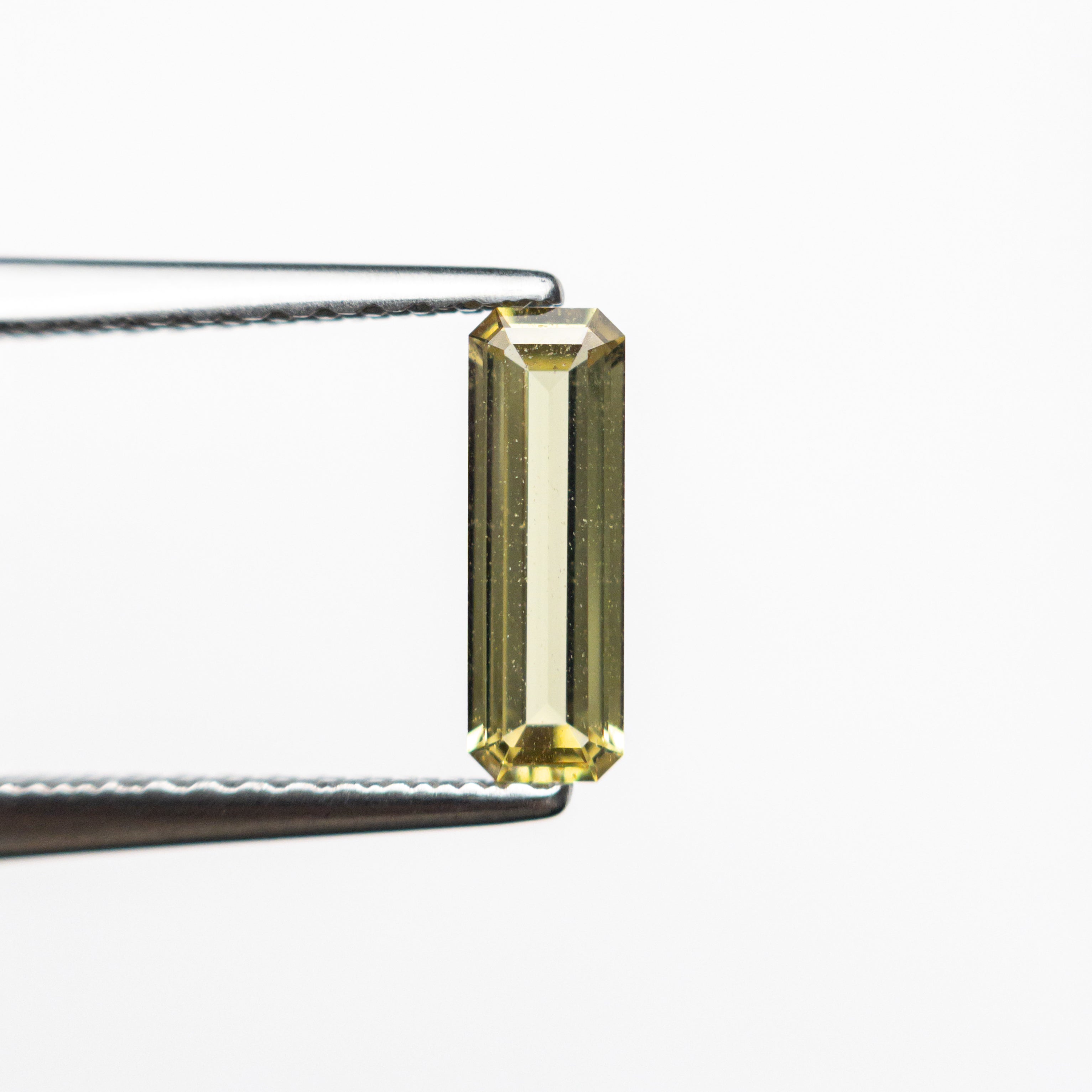 0.44ct 8.40x2.79x1.63mm Cut Corner Rectangle Step Cut Sapphire 23780-02-Staghead Designs