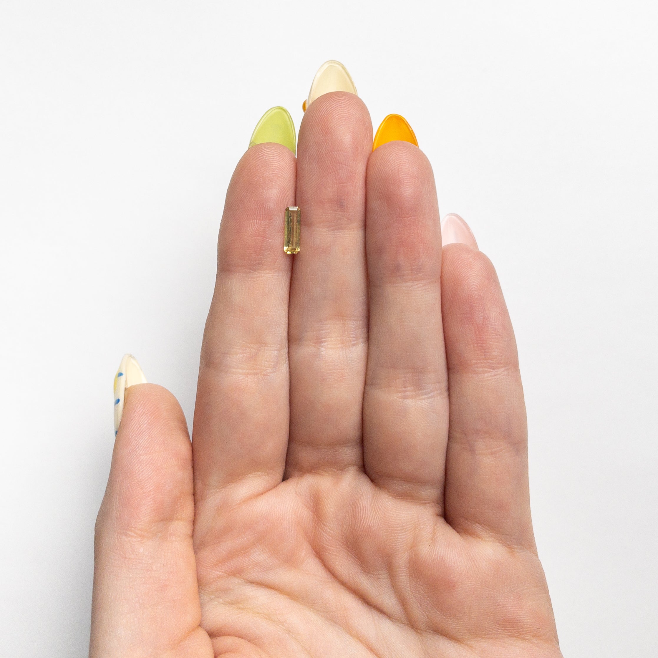 0.44ct 8.40x2.79x1.63mm Cut Corner Rectangle Step Cut Sapphire 23780-02-Staghead Designs