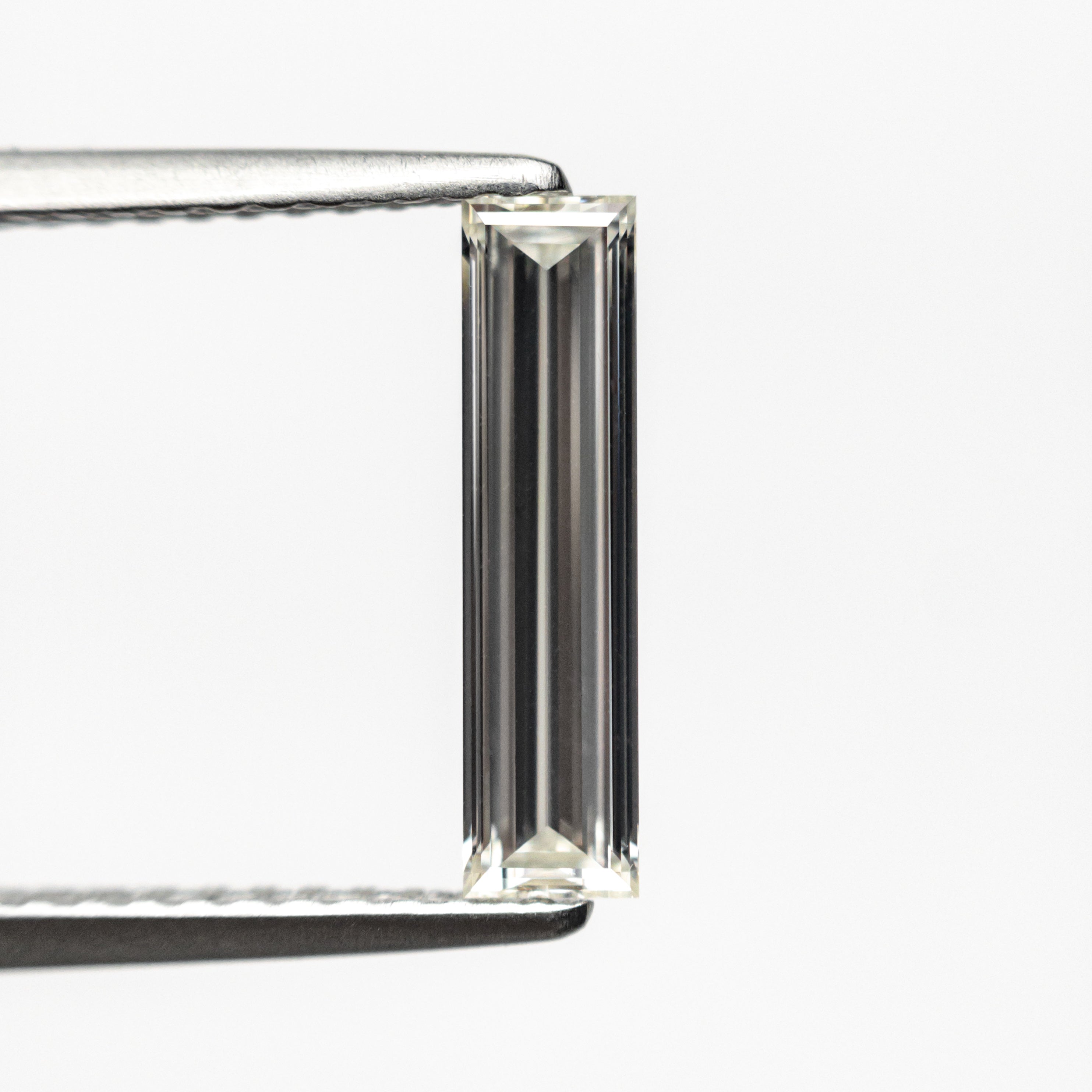 0.70ct 11.58x2.89x1.80mm GIA Internally Flawless H Baguette Step Cut 24300-01-Staghead Designs