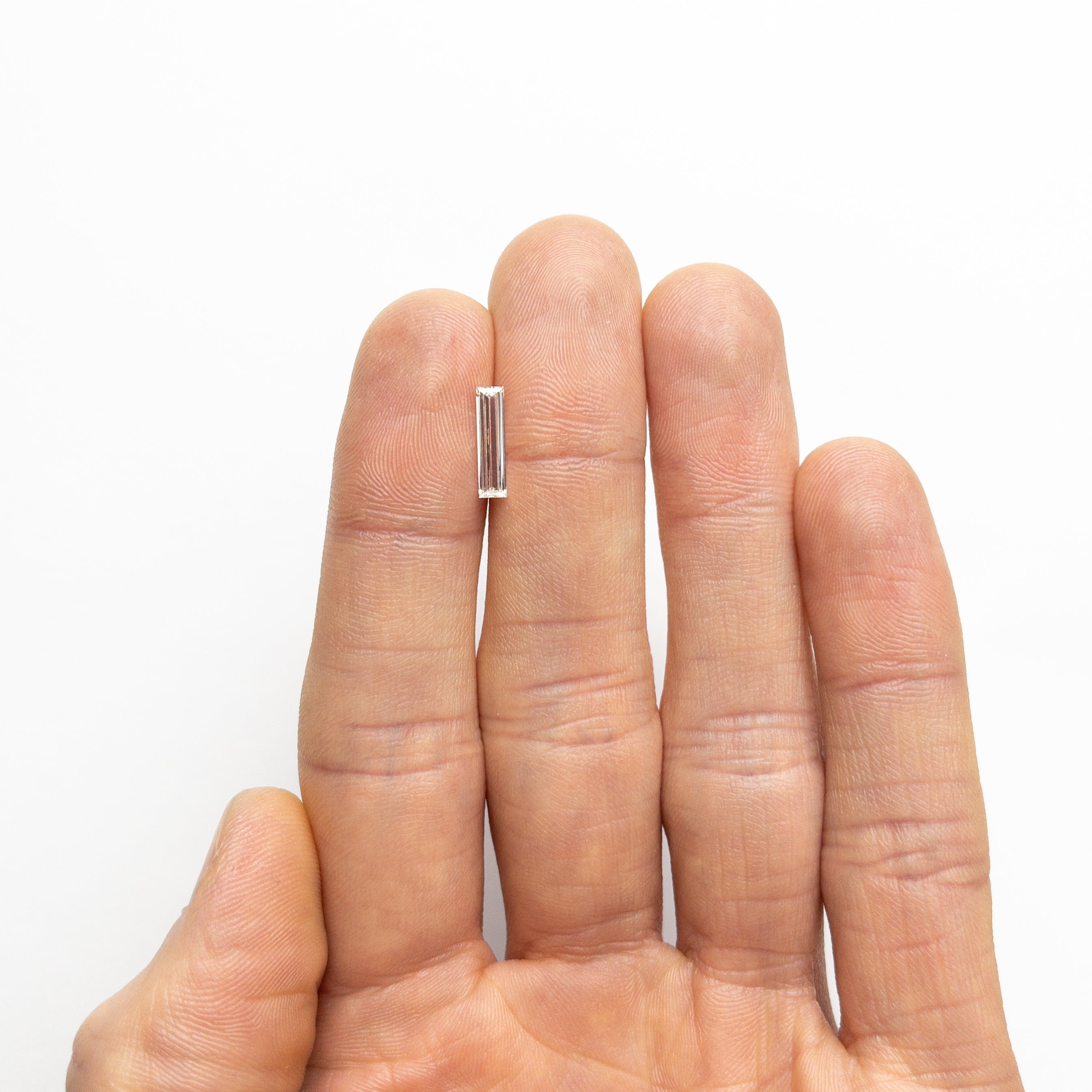 0.70ct 11.58x2.89x1.80mm GIA Internally Flawless H Baguette Step Cut 24300-01-Staghead Designs