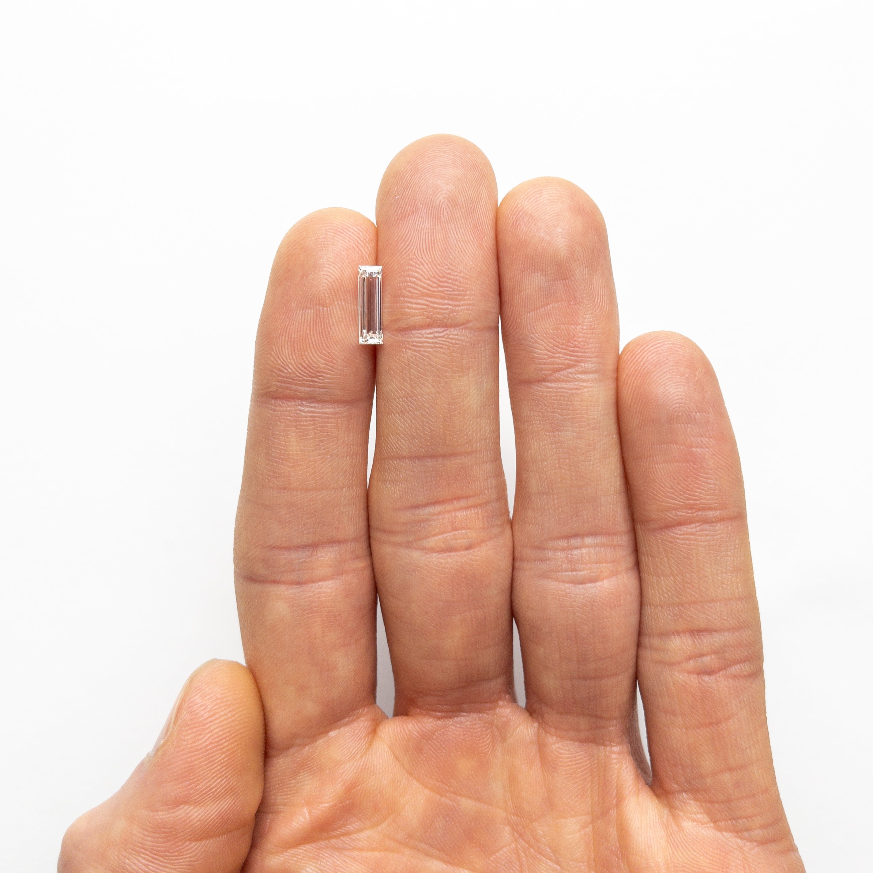 0.71ct 10.48x3.17x1.86mm GIA Internally Flawless I Baguette Step Cut 24302-01-Staghead Designs