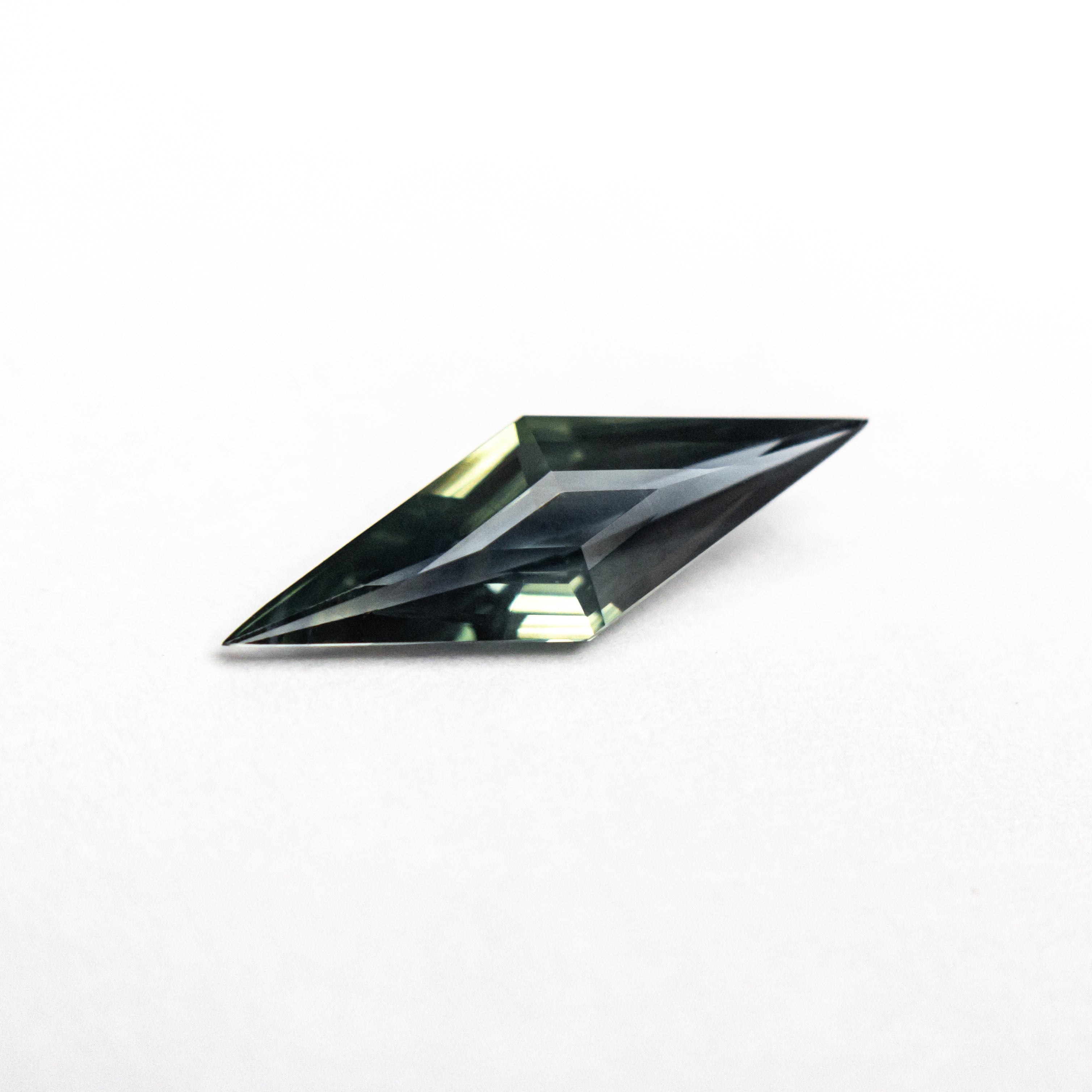0.55ct 11.81x3.99x2.27mm Lozenge Step Cut Sapphire 25196-09-Staghead Designs