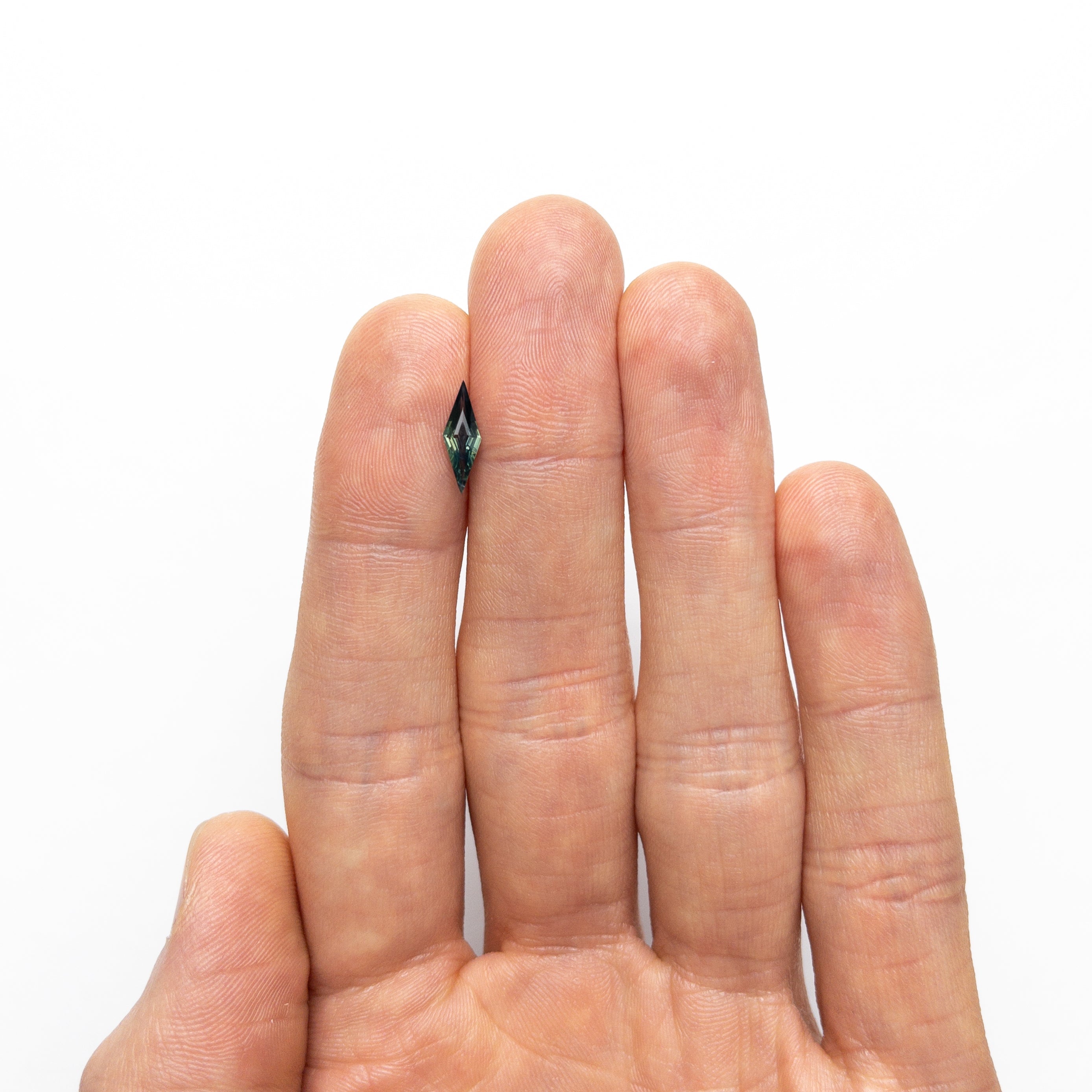 0.55ct 11.81x3.99x2.27mm Lozenge Step Cut Sapphire 25196-09-Staghead Designs