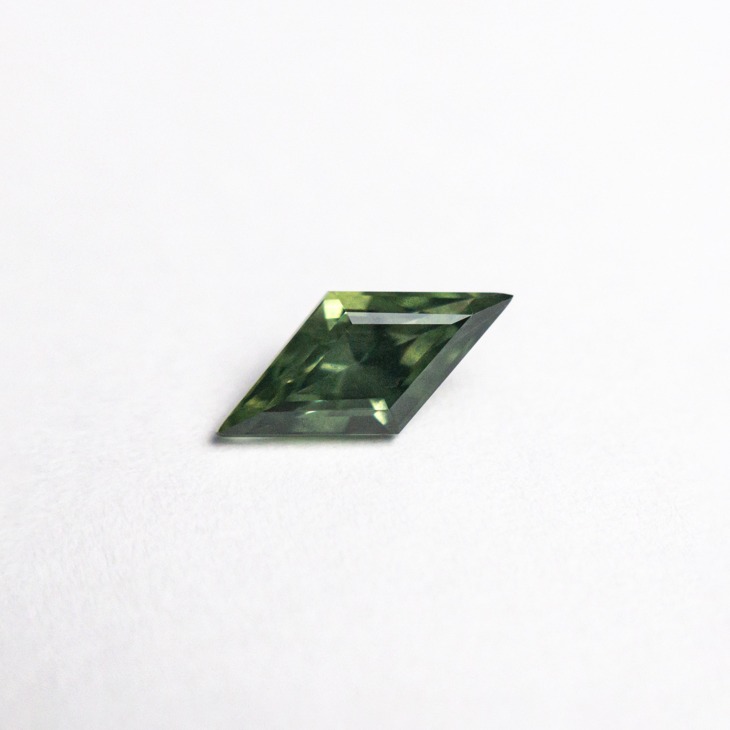 0.62ct 8.76x4.28x3.13mm Lozenge Step Cut Sapphire 25740-04-Staghead Designs