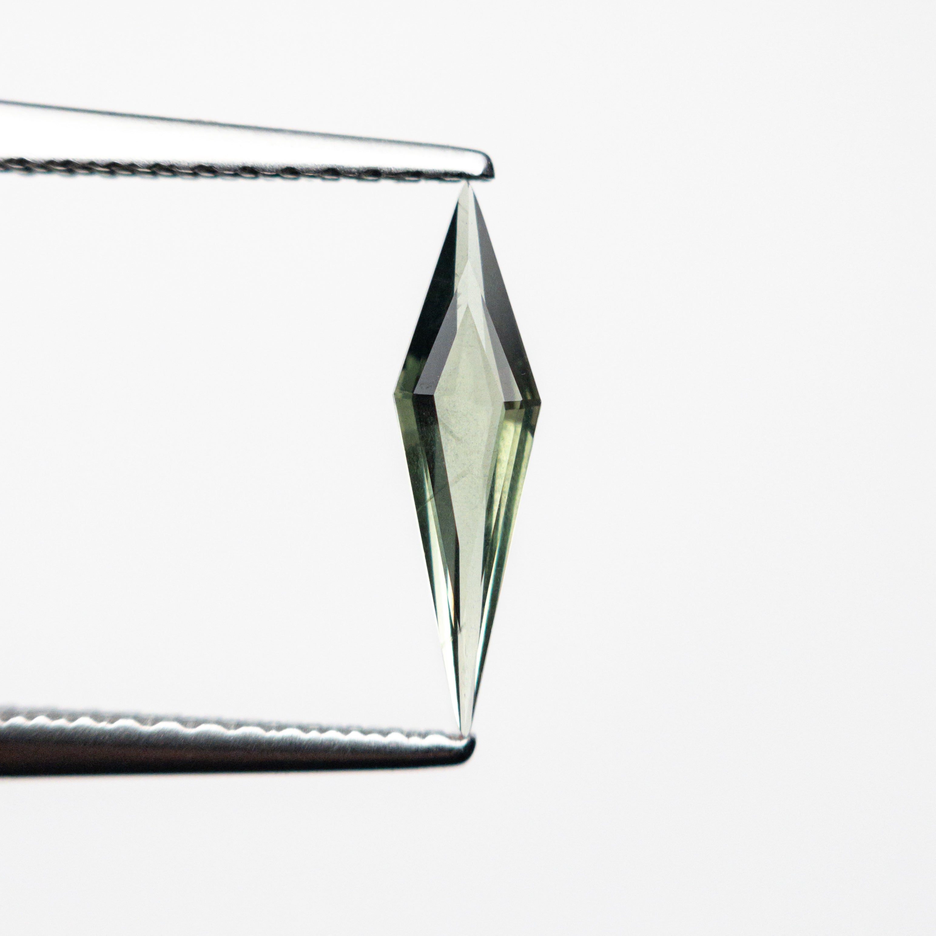 0.35ct 11.64x3.08x1.53mm Kite Step Cut Sapphire 25740-16-Staghead Designs