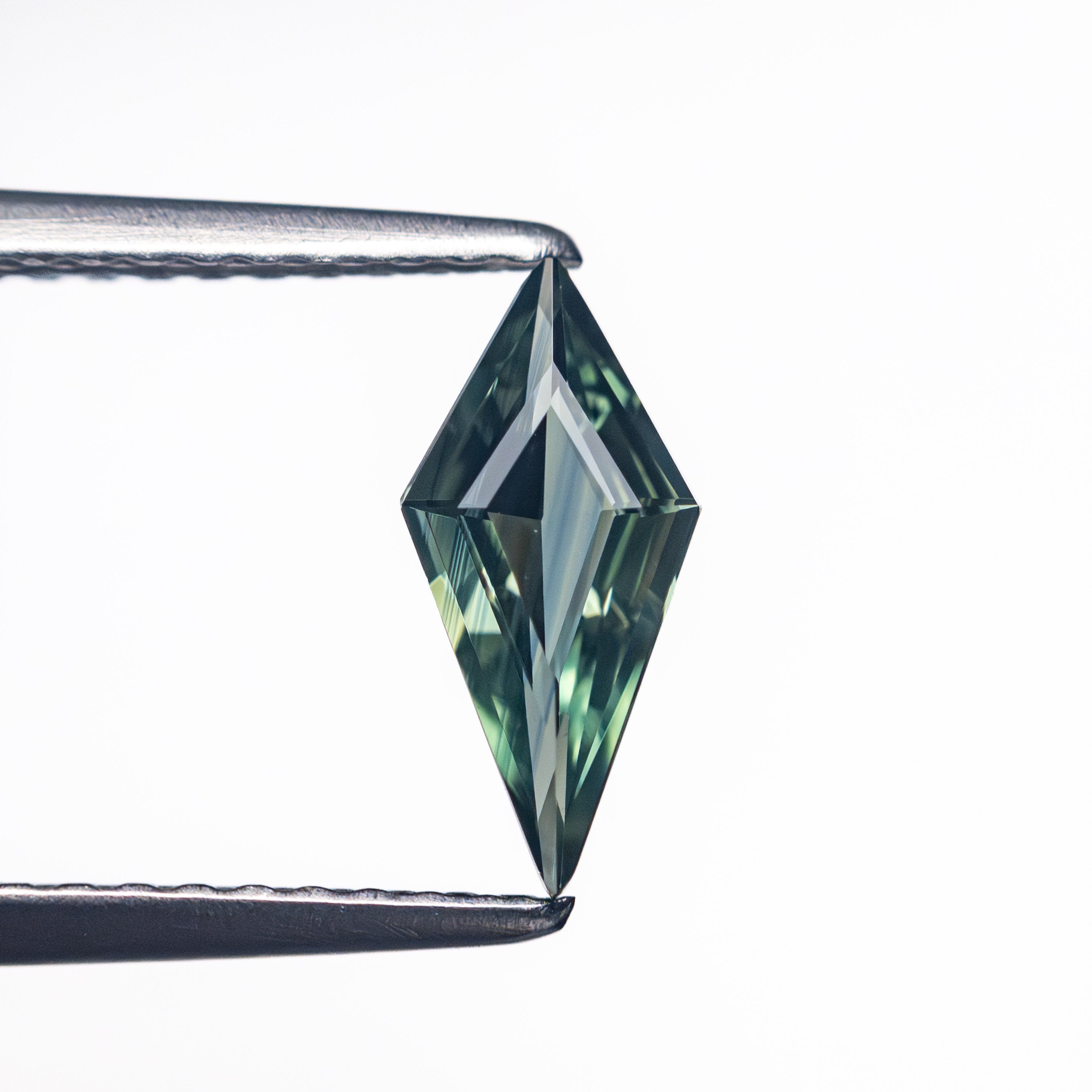 0.56ct 9.56x4.48x2.27mm Kite Step Cut Sapphire 25740-24-Staghead Designs