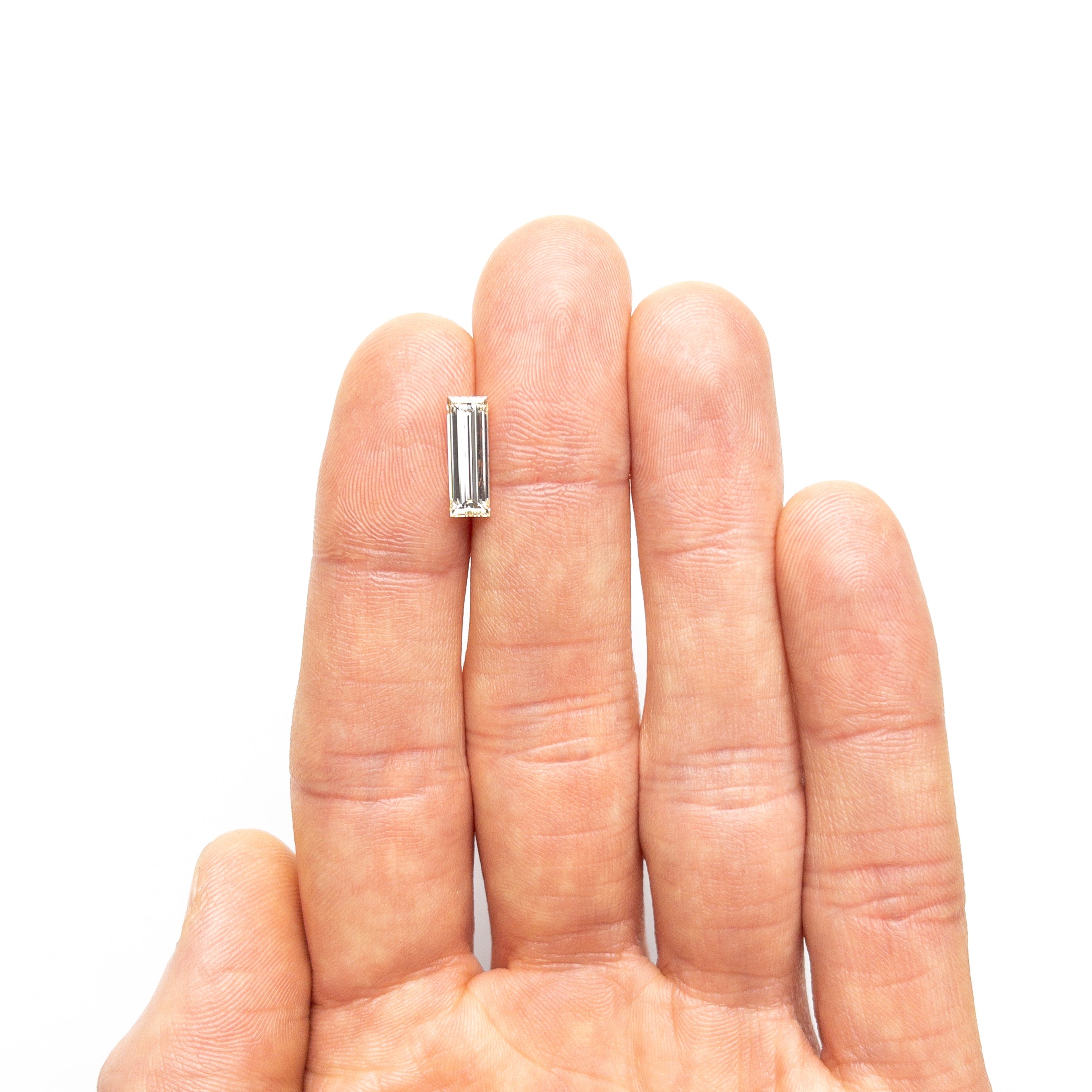 1.52ct 12.21x4.16x2.86mm VS2 O-P Baguette Step Cut 26124-01-Staghead Designs