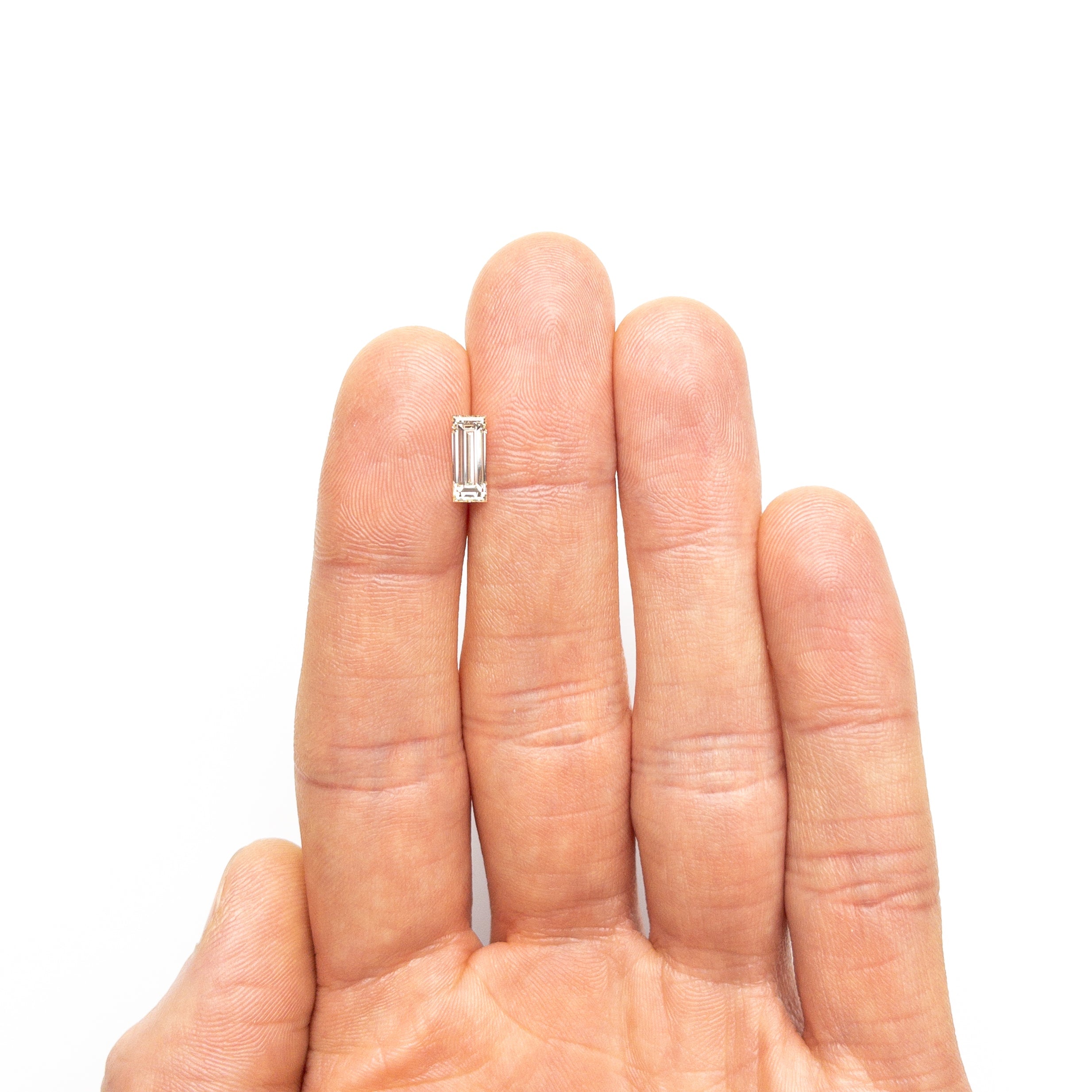 1.11ct 9.55x3.80x2.97mm VS2 O-P Baguette Step Cut 26124-02-Staghead Designs