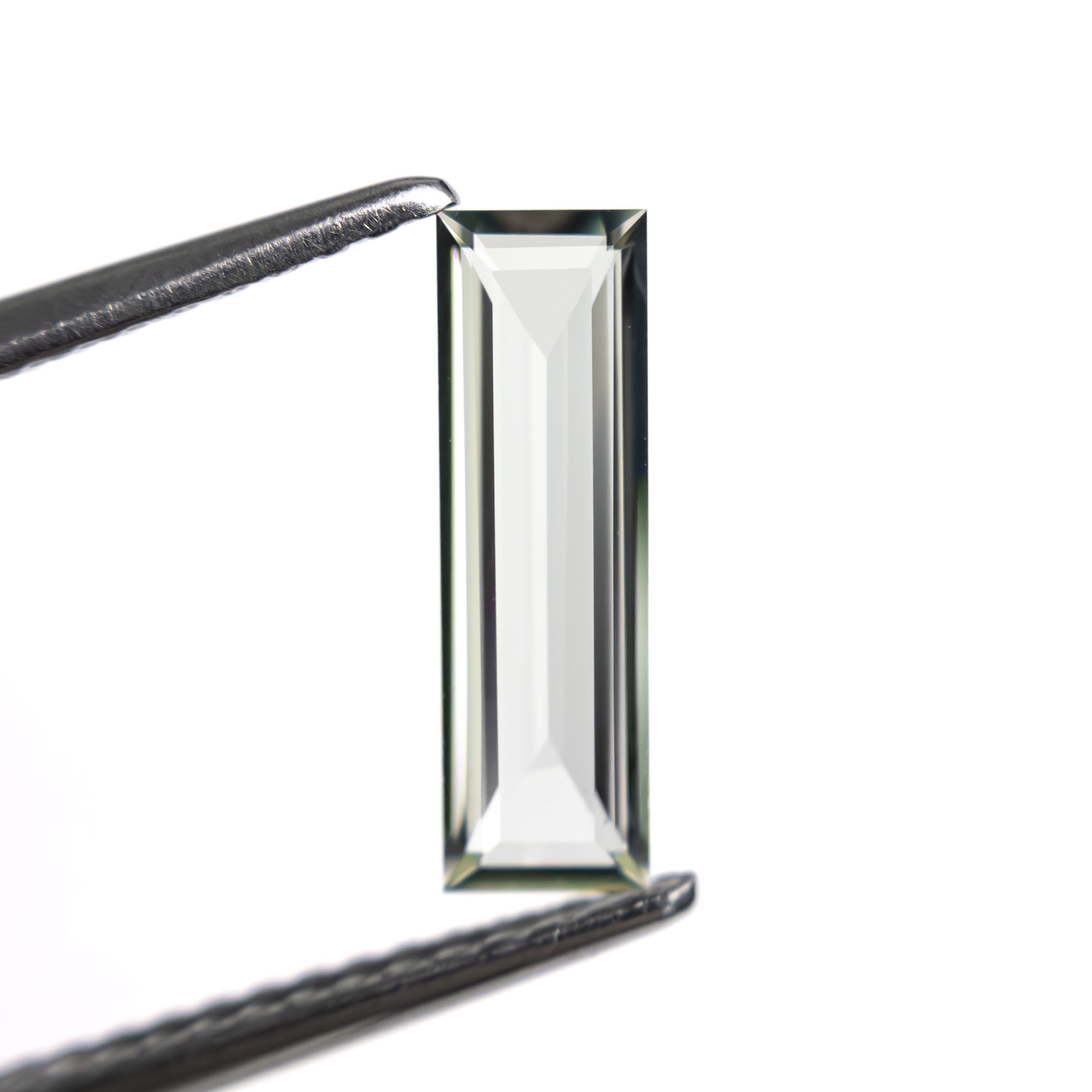 0.81ct 11.41x3.48x1.63mm Baguette Step Cut Sapphire 27720-05-Staghead Designs