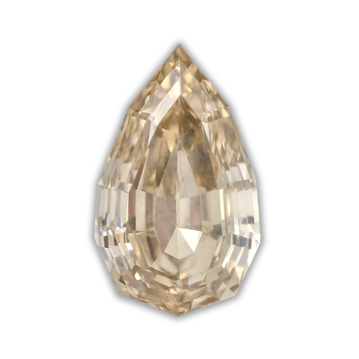 A pear cut diamond with light brown color on a white background