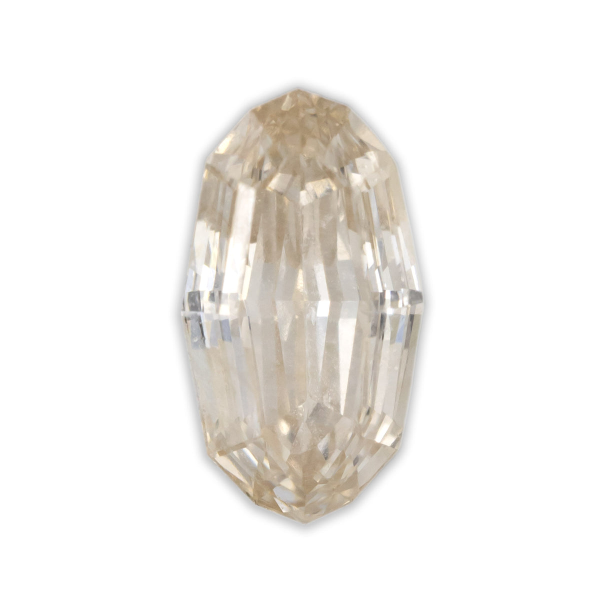 An oval cut champagne diamond on a white background