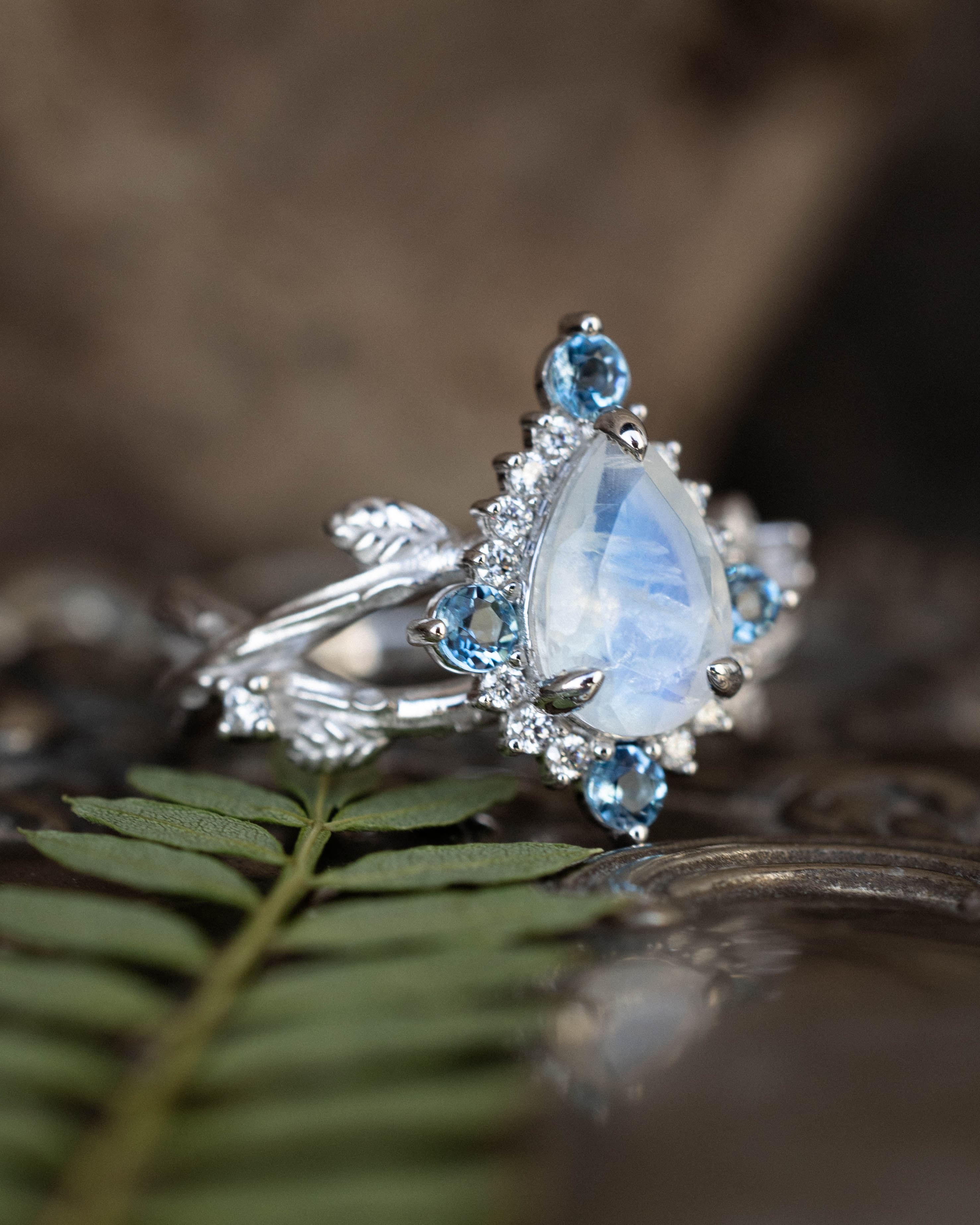 "ARTEMIS ON THE VINE DIVINE" - PEAR CUT MOONSTONE ENGAGEMENT RING WITH DIAMOND & AQUAMARINE ACCENTS IN A BRANCH-STYLE BAND-Staghead Designs
