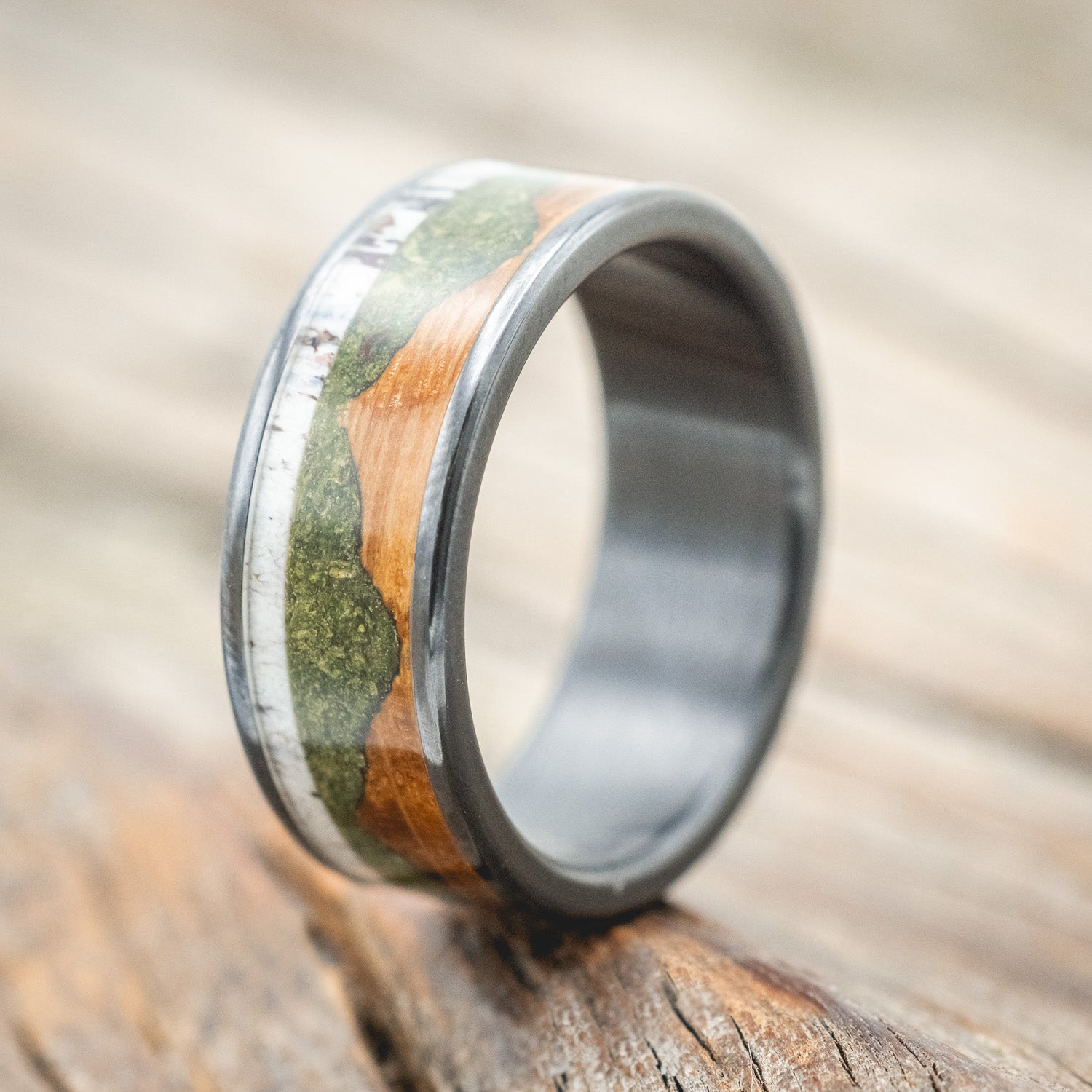 "Voyager" - men's wedding ring featuring moss-filled mountain engraving with whiskey barrel oak & antler inlays