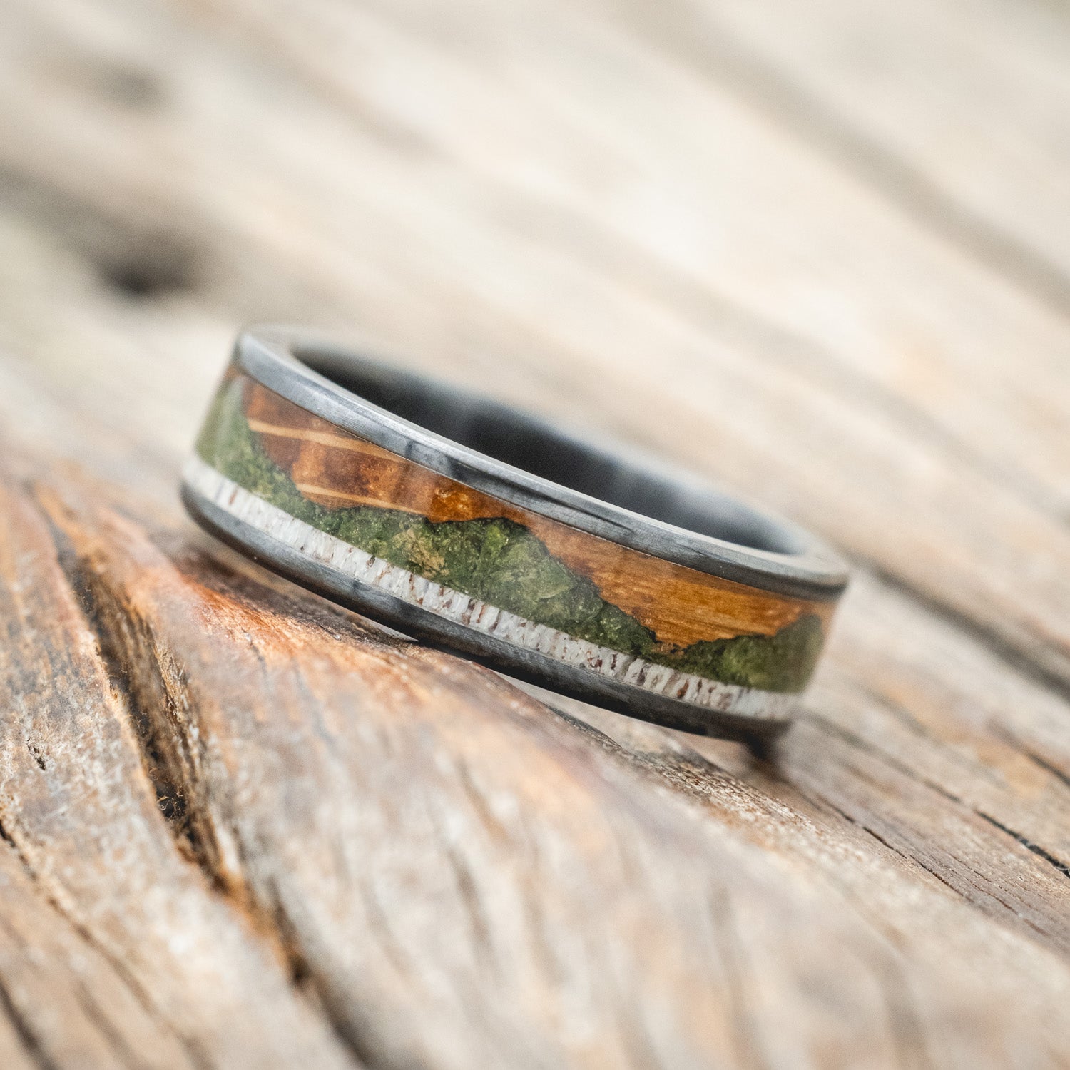"Voyager" - men's wedding ring featuring moss-filled mountain engraving with whiskey barrel oak & antler inlays
