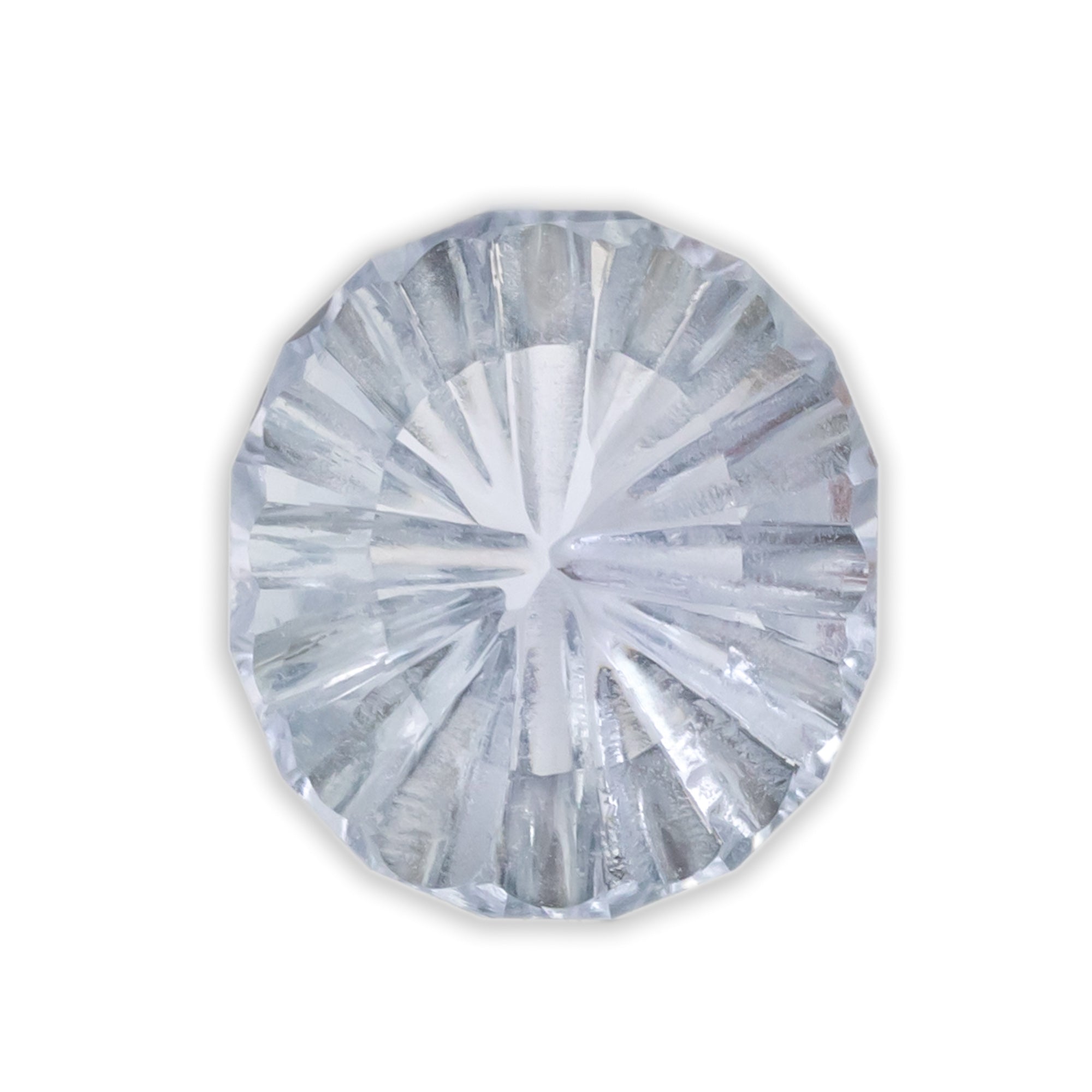 Concave cut silver sapphire on a white background