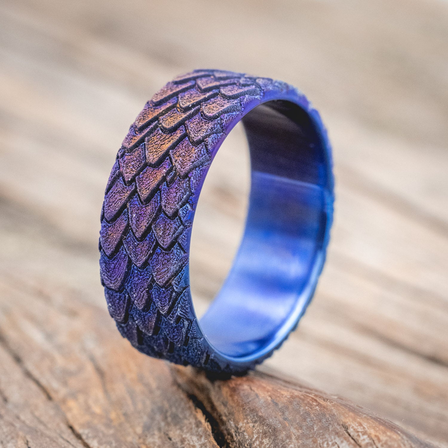 "Echo" thicker wedding band featuring fire-treated titanium with a custom embossed 3D dragon scale