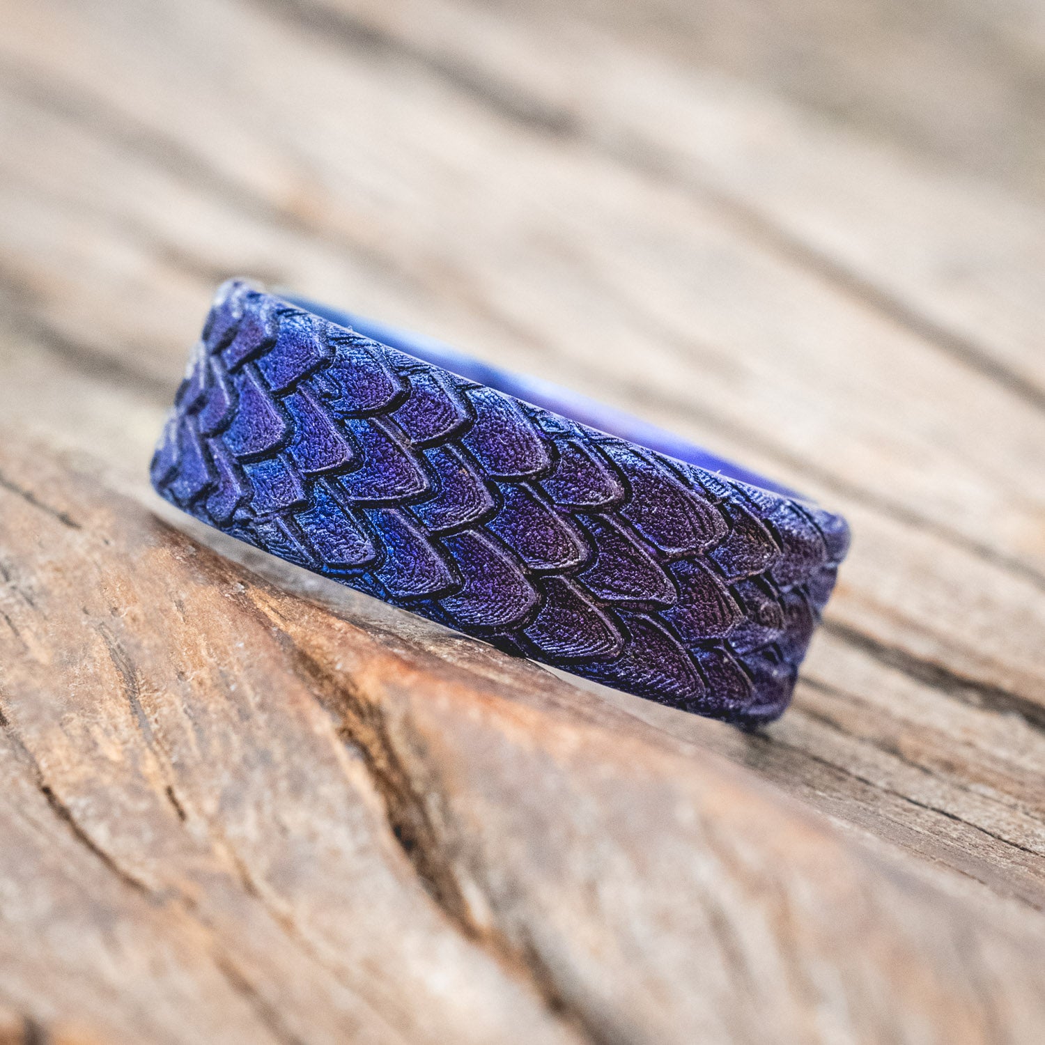 "Echo" thicker wedding band featuring fire-treated titanium with a custom embossed 3D dragon scale
