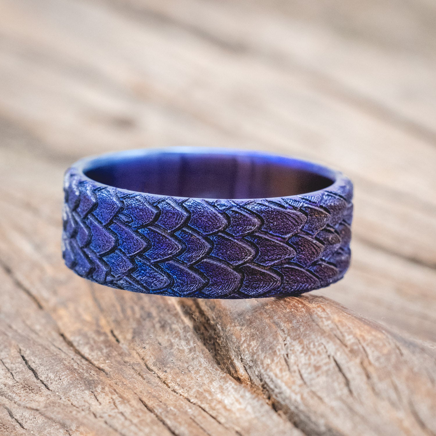 "Echo" thicker wedding band featuring fire-treated titanium with a custom embossed 3D dragon scale