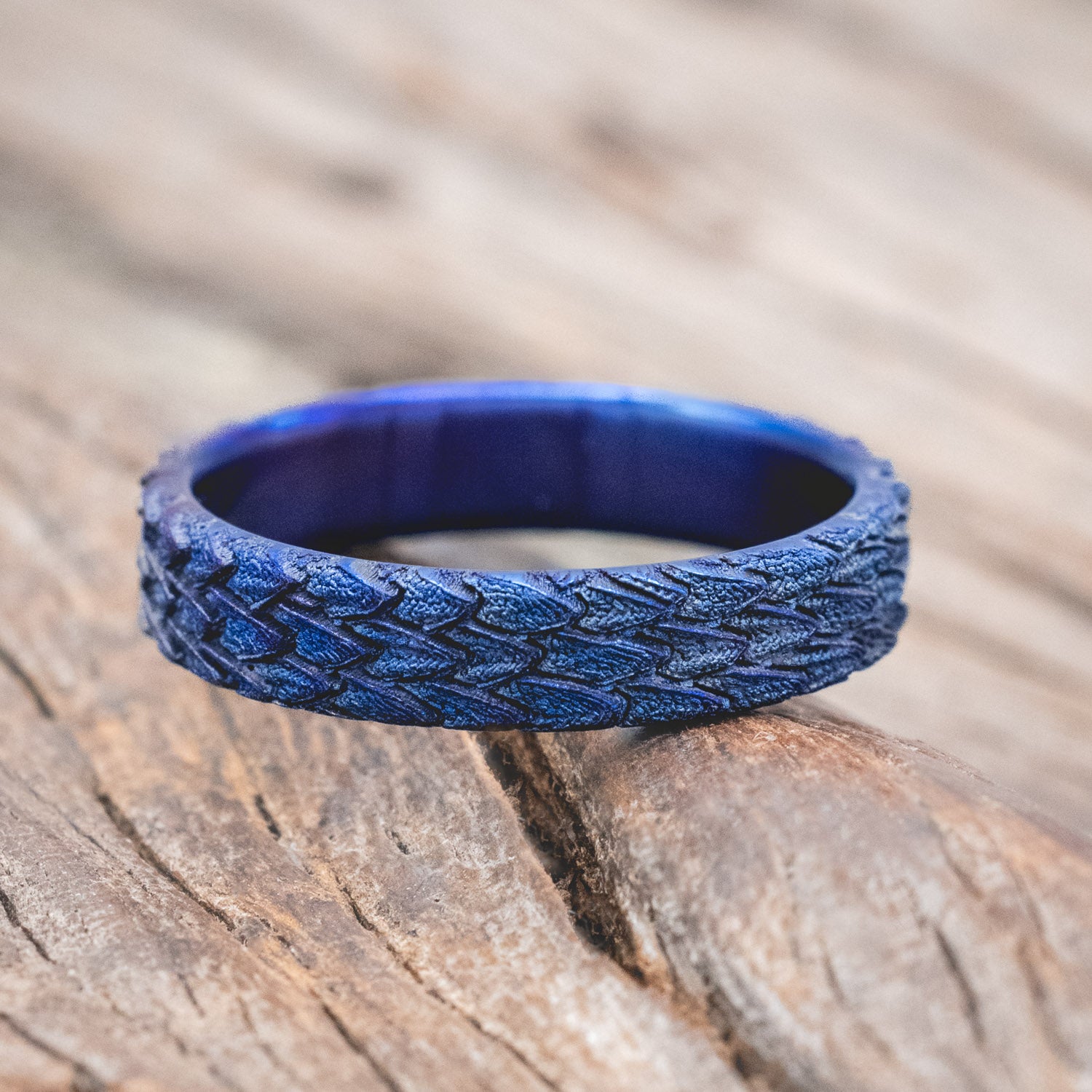 "Echo" thinner wedding band featuring fire-treated titanium with a custom embossed 3D dragon scale