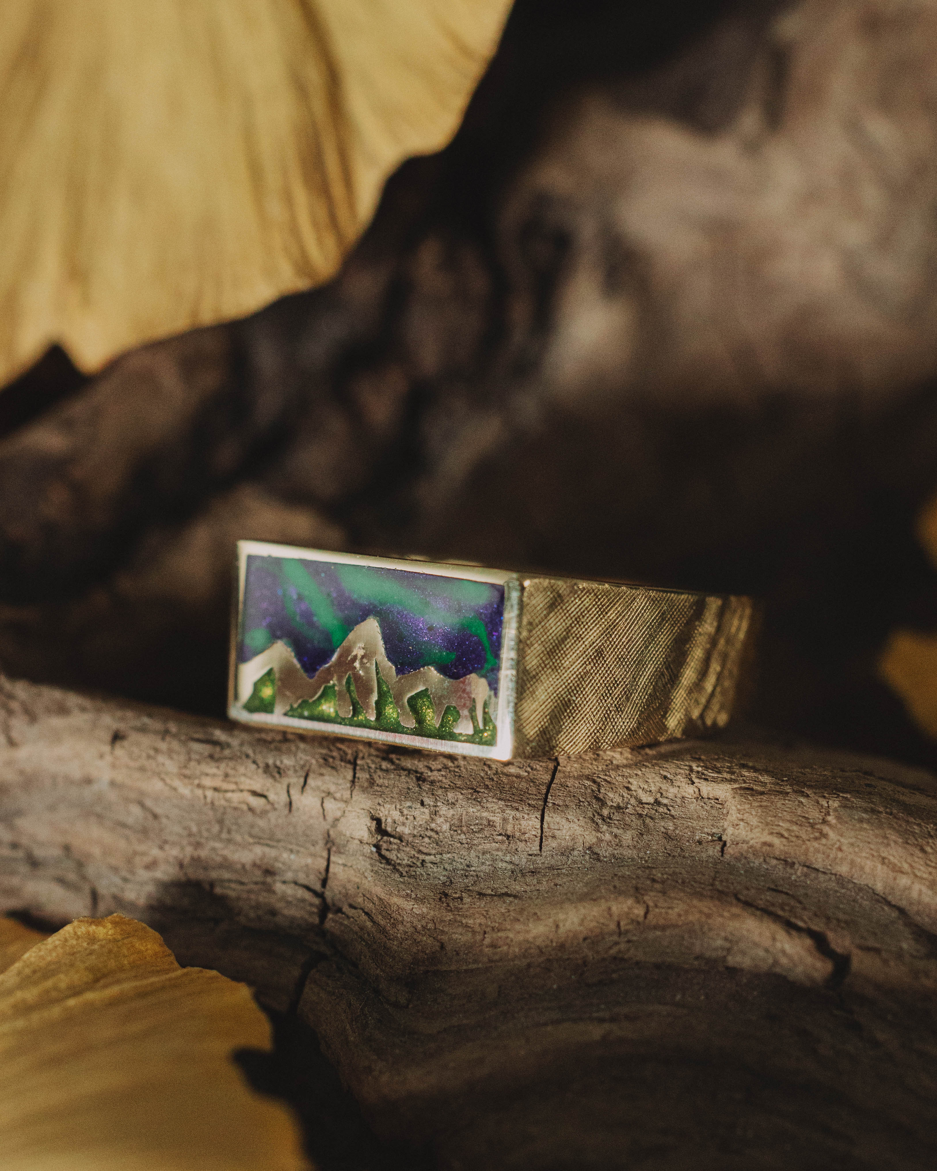 "ATLAS" - MOUNTAIN ENGRAVED WEDDING BAND WITH GLOW IN THE DARK NORTHERN LIGHTS, A MYSTIC MOSS INLAY, AND A FLORENTINE FINISH-Staghead Designs