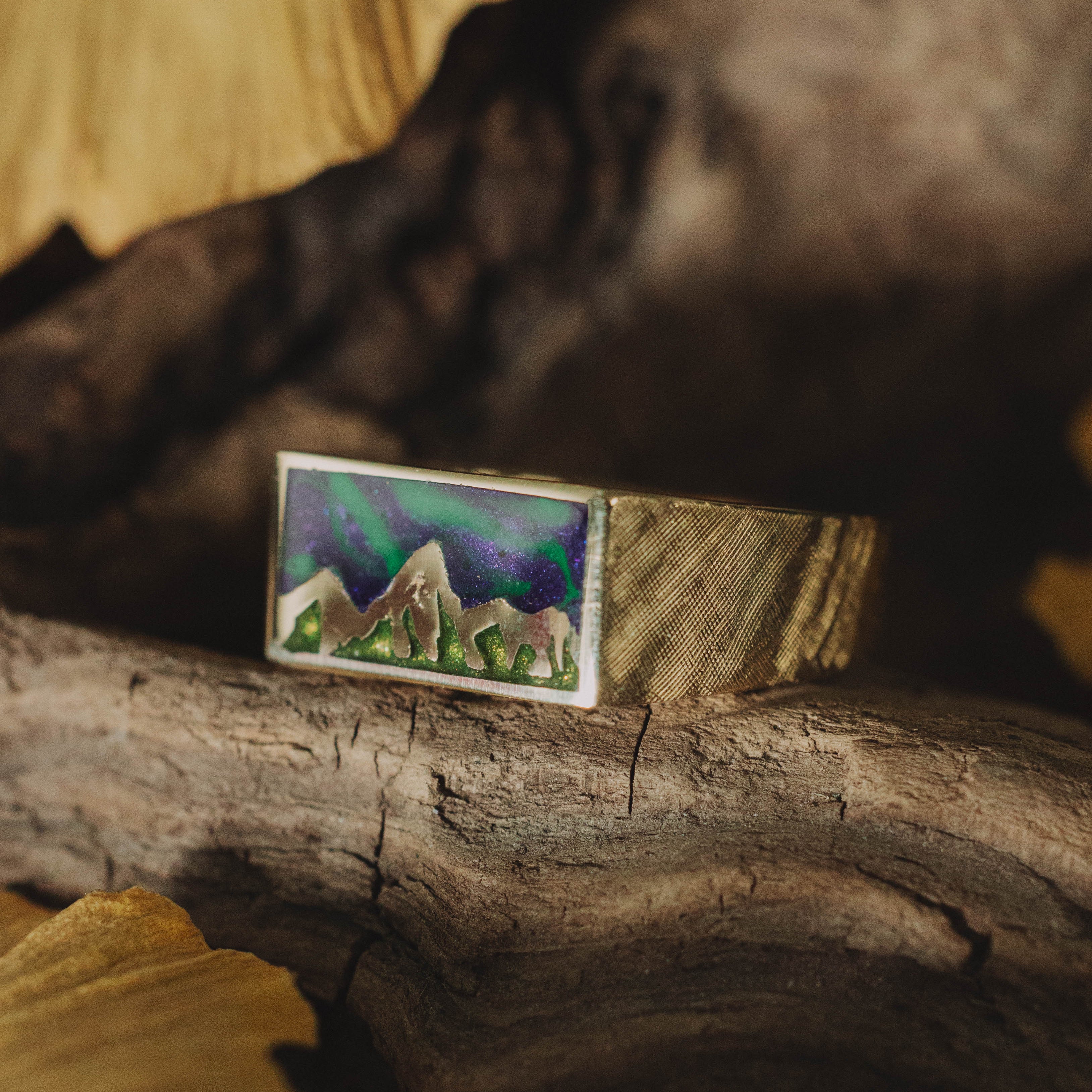 "ATLAS" - MOUNTAIN ENGRAVED WEDDING BAND WITH GLOW IN THE DARK NORTHERN LIGHTS, A MYSTIC MOSS INLAY, AND A FLORENTINE FINISH-Staghead Designs