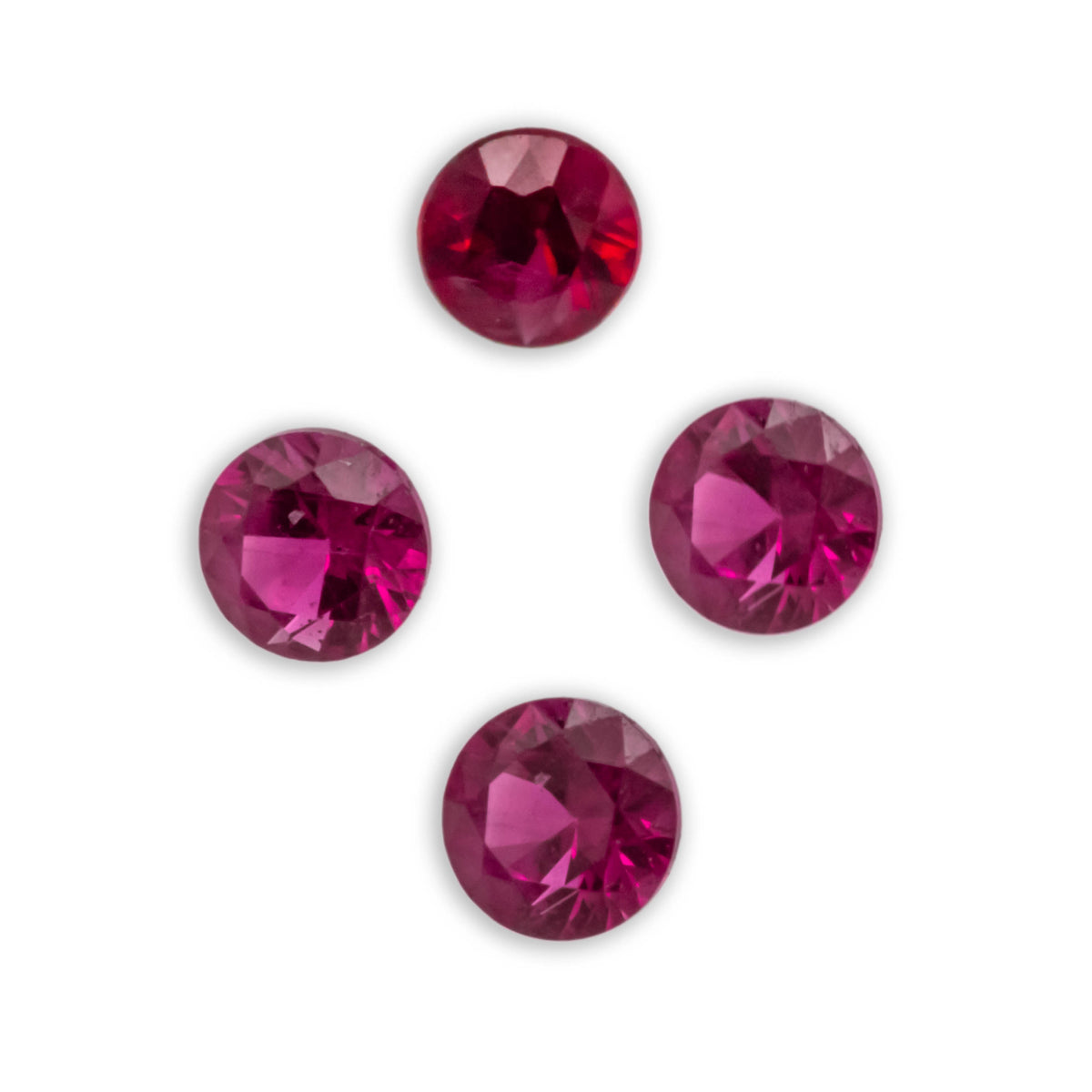 4 round rubies on white background