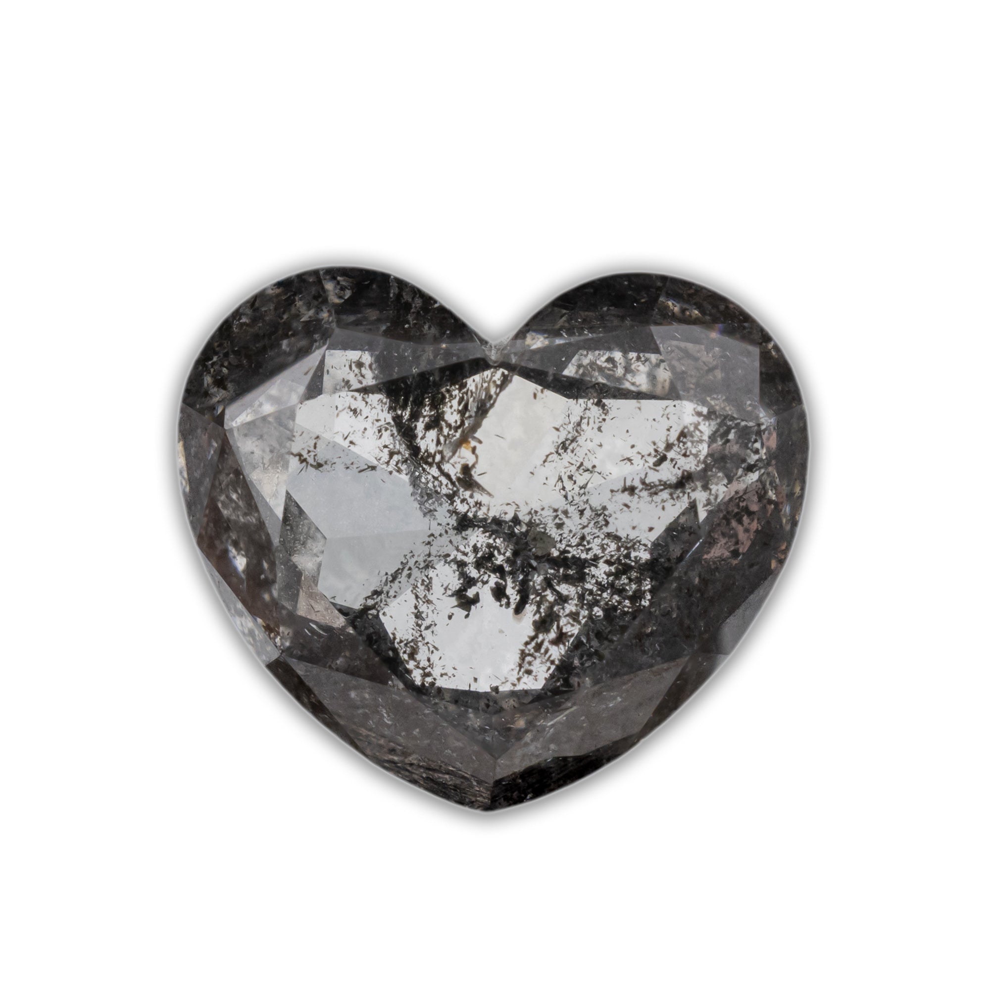 A heart shaped salt & pepper diamond with black inclusions on a white background