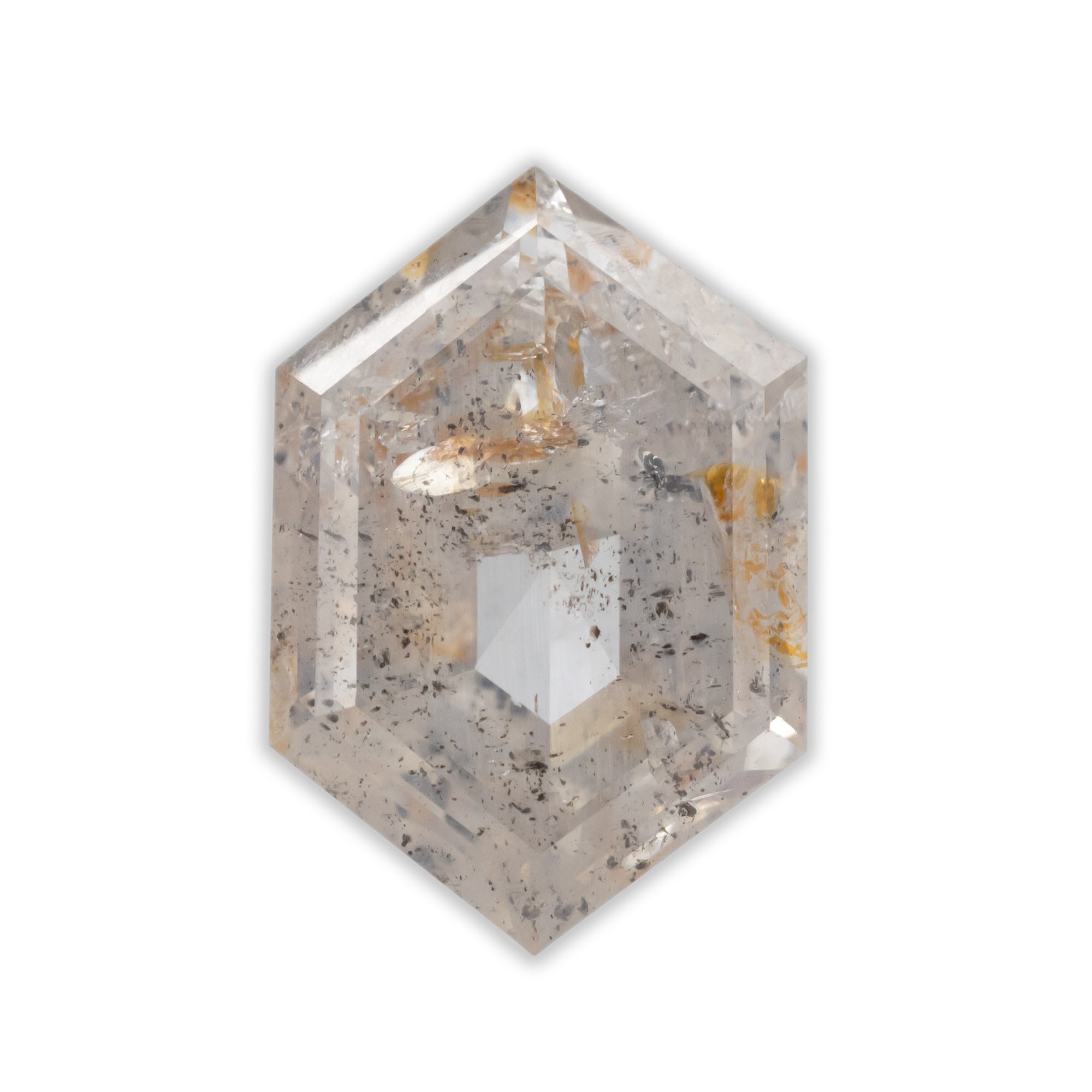 A hexagon cut salt & pepper diamond with subtle peach hue on a white background