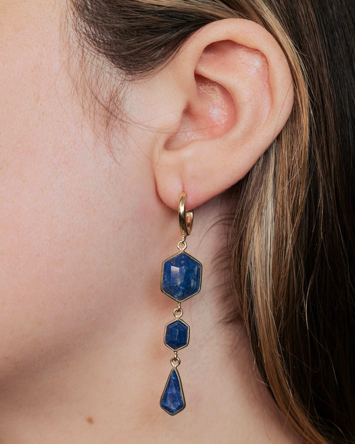 On ear photo of 18K Gold Vermeil Blue Lapis Lazuli Dangle Earrings with a 925 Sterling Silver base