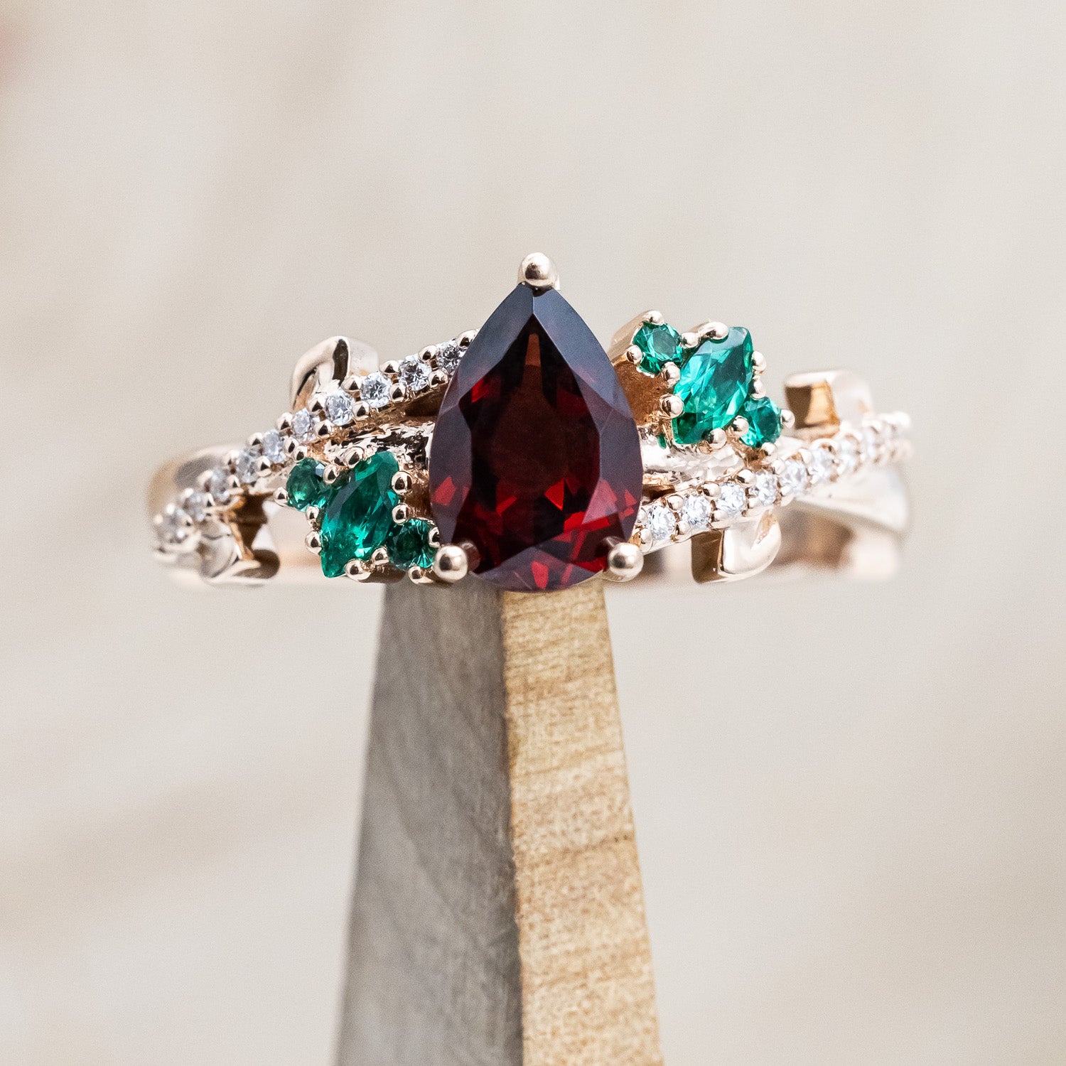 "KAMILA" - PEAR CUT MOZAMBIQUE GARNET ENGAGEMENT RING WITH EMERALD & DIAMOND ACCENTS-Staghead Designs