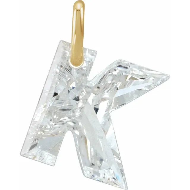 Diamond pendant shaped like the letter 'K' on a white background
