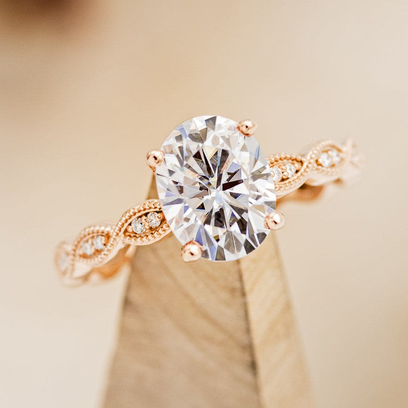 "NOUR" - OVAL MOISSANITE ENGAGEMENT RING WITH DIAMOND ACCENTS-1