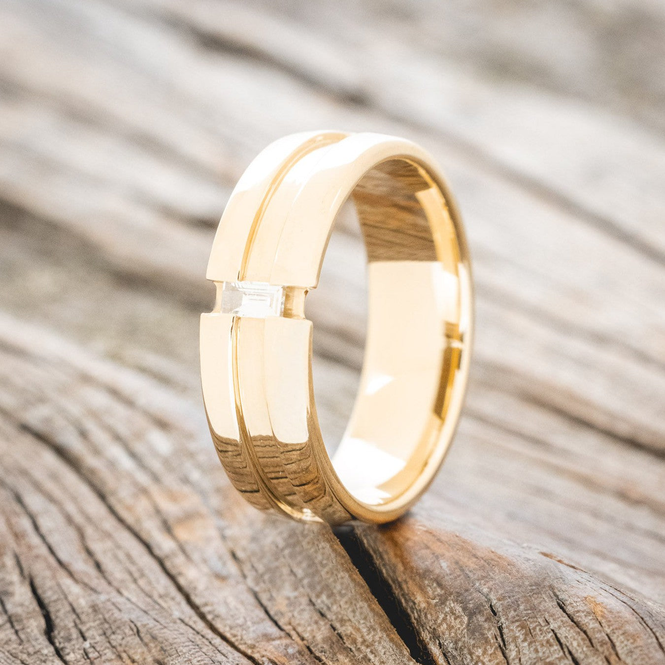 NOTCHED BAND MEN'S ENGAGEMENT RING WITH A BAGUETTE DIAMOND ACCENT