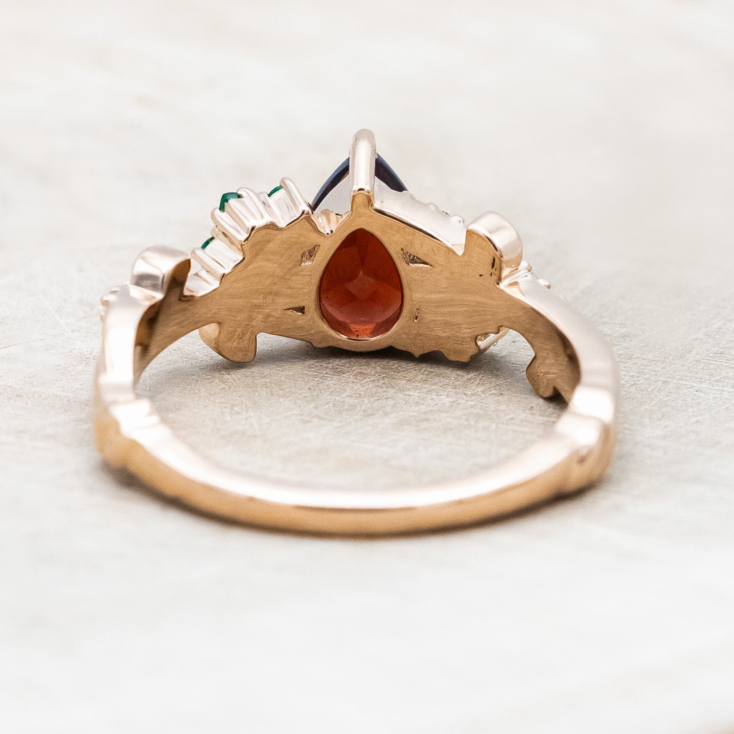 "KAMILA" - PEAR CUT MOZAMBIQUE GARNET ENGAGEMENT RING WITH EMERALD & DIAMOND ACCENTS-Staghead Designs