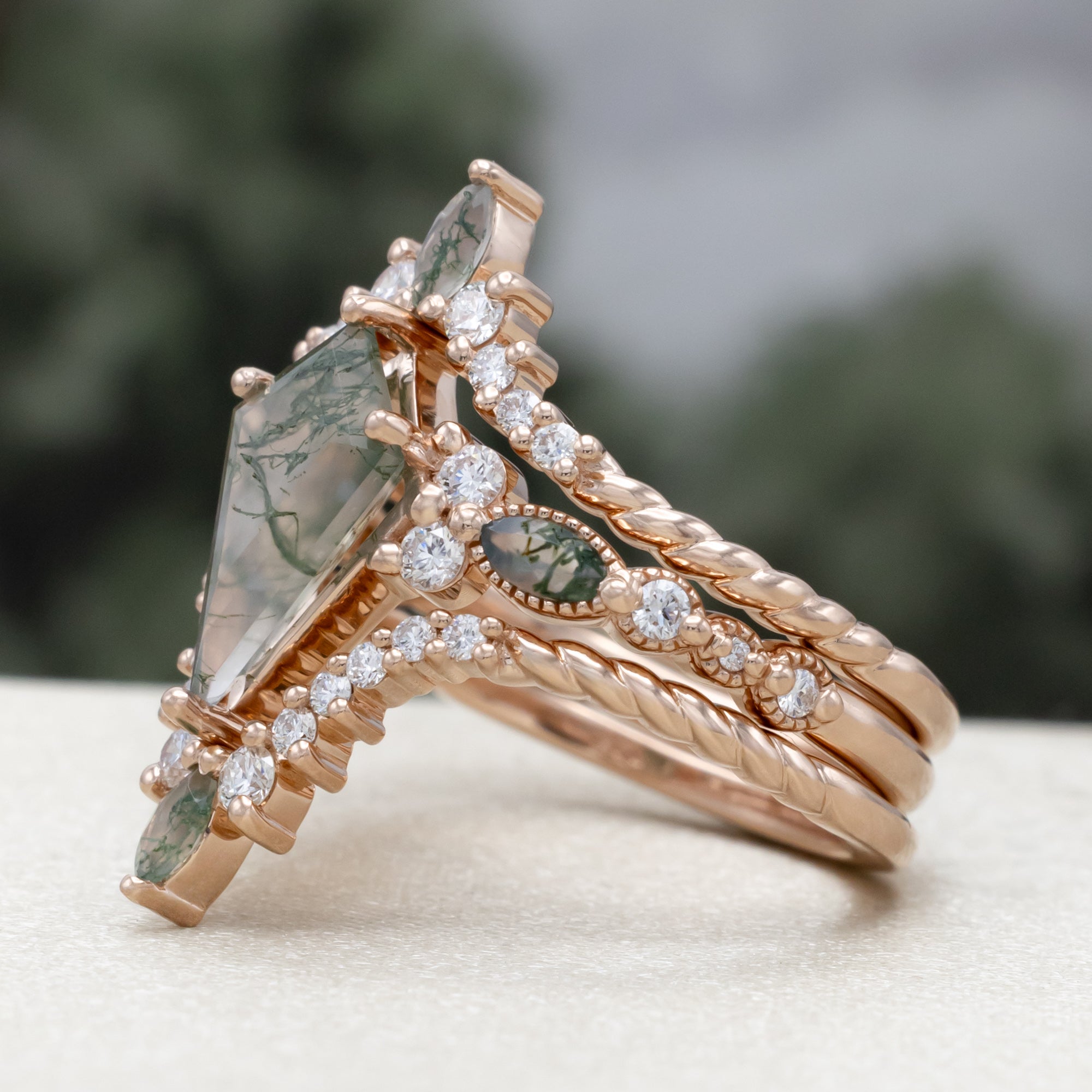 "Shimmering Sage" - Bridal Suite - Kite Cut Moss Agate Engagement Ring With Marquise Moss Agate Accents & A Diamond Tracer-Staghead Designs