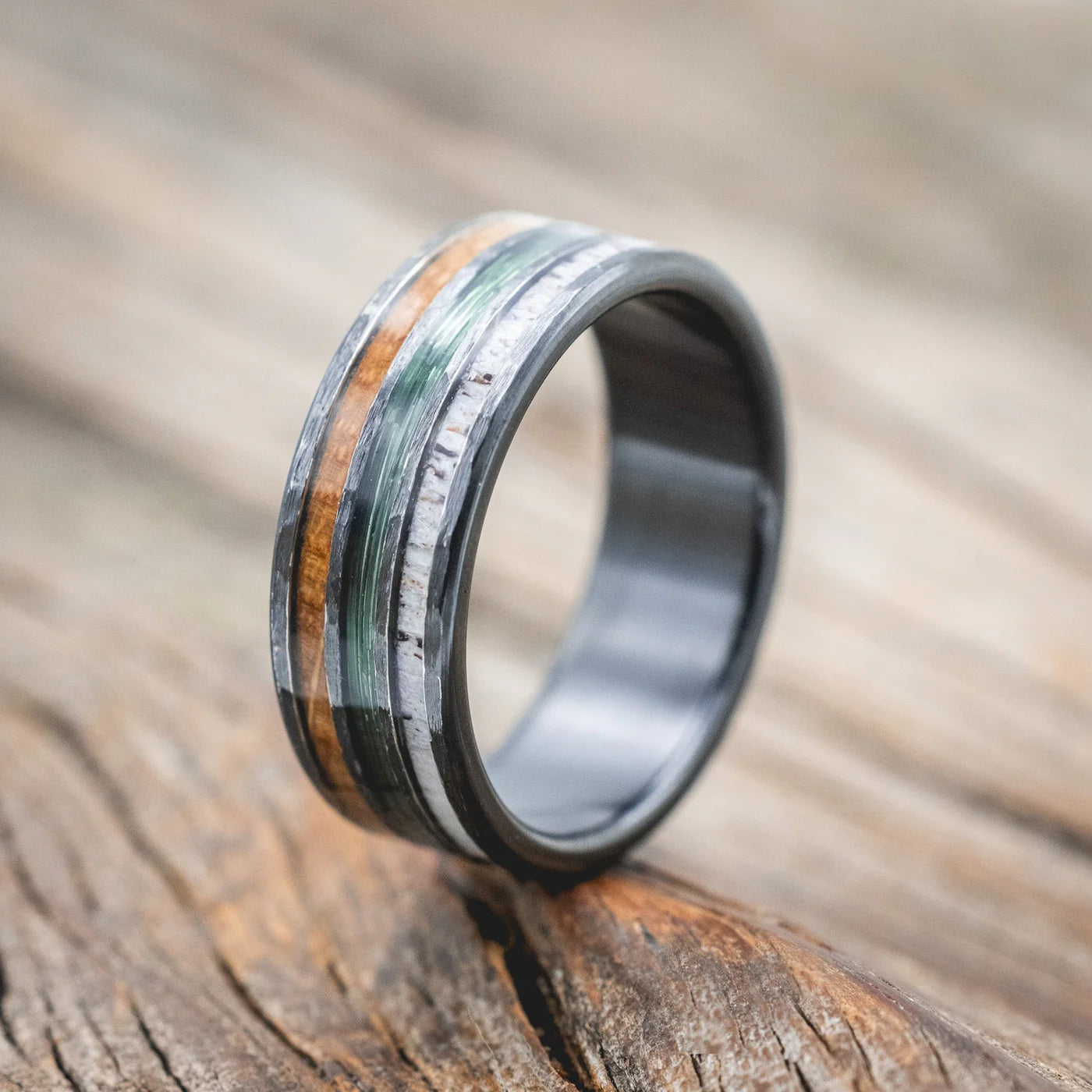 "RIO" - ANTLER, GREEN MONO FISHING LINE, AND WHISKEY BARREL OAK WEDDING BAND WITH A HAMMERED FINISH - BLACK ZIRCONIUM - SIZE 11 1/2-Staghead Designs