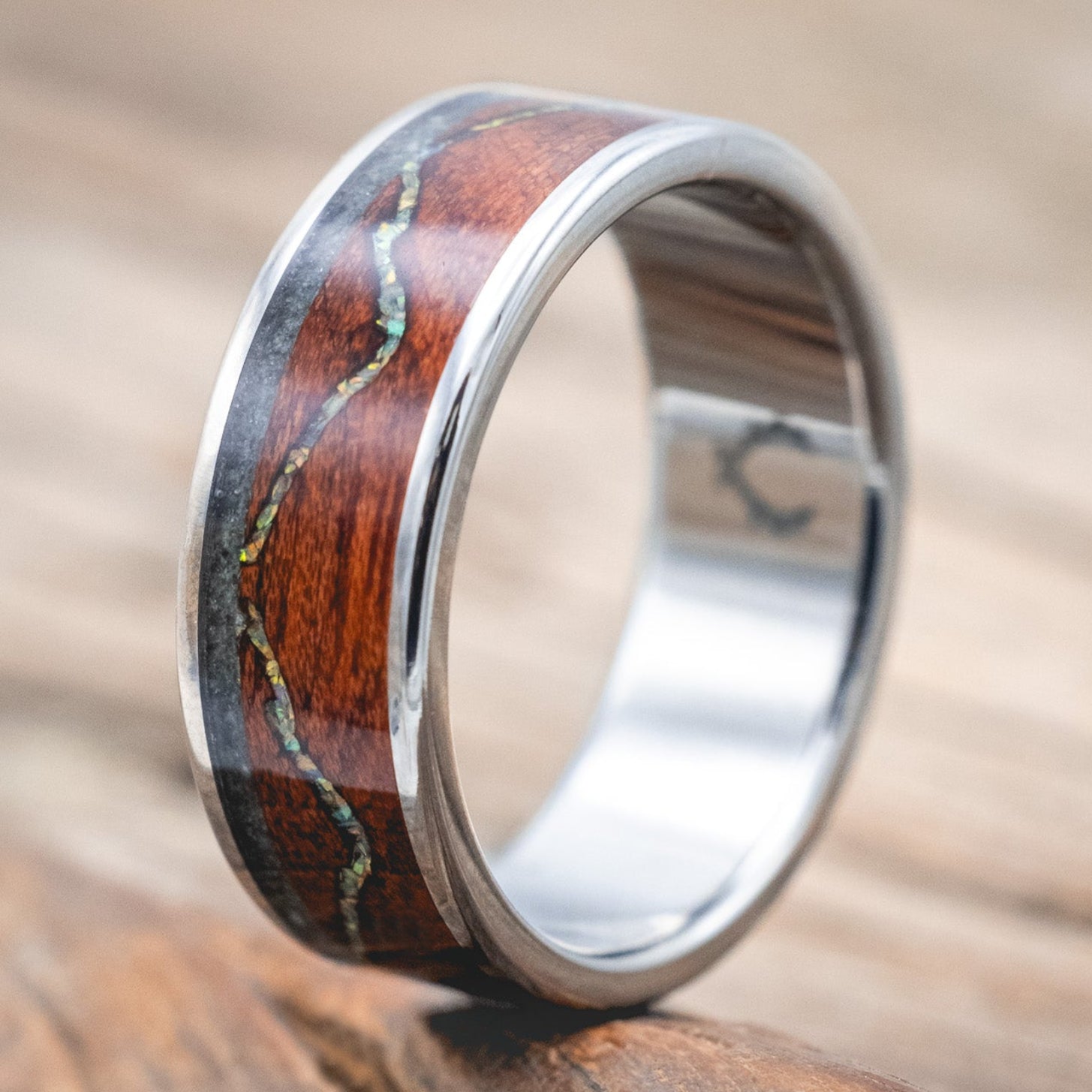 "The Expedition" - men's wedding ring featuring a mountain engraving with fire & ice opal, rosewood, and moss agate inlays