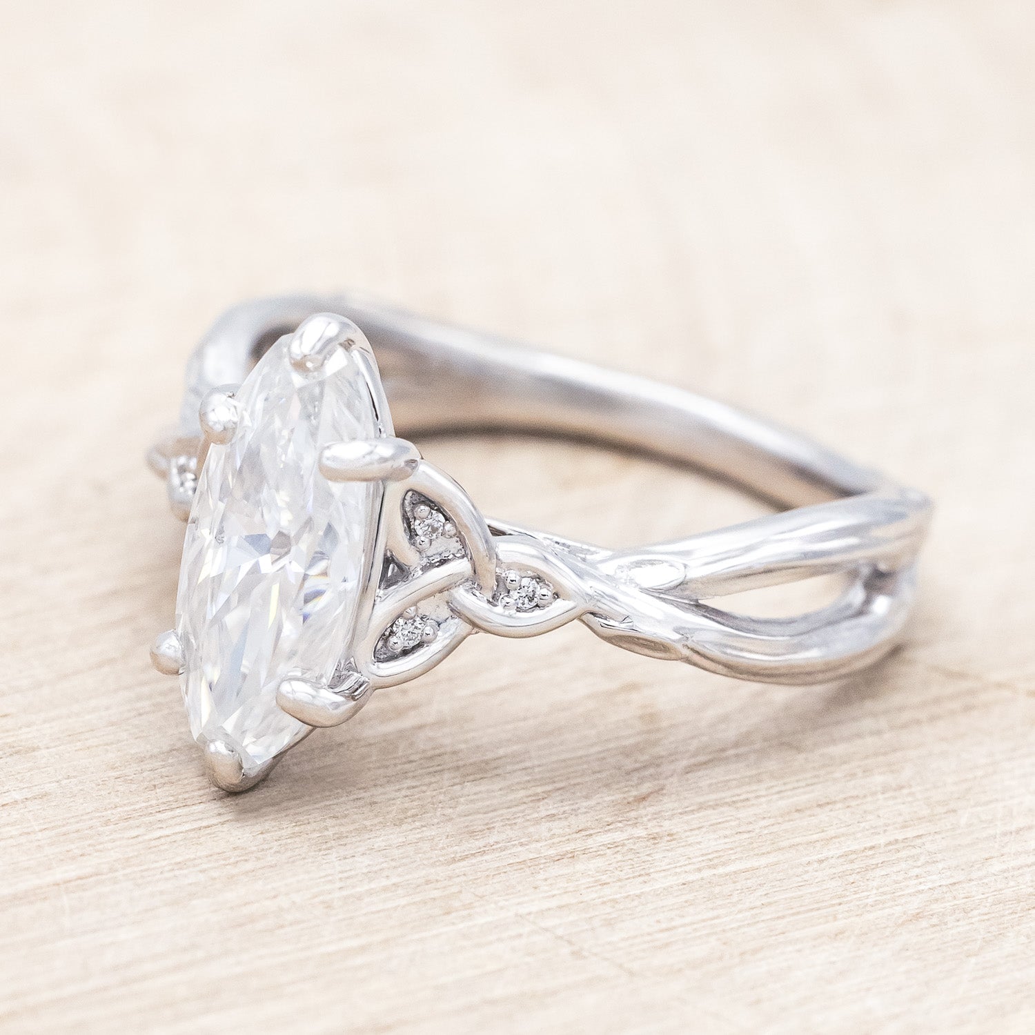 Side view of "Amaris" - Celtic knot-style Moissanite women's engagement ring with diamond accents