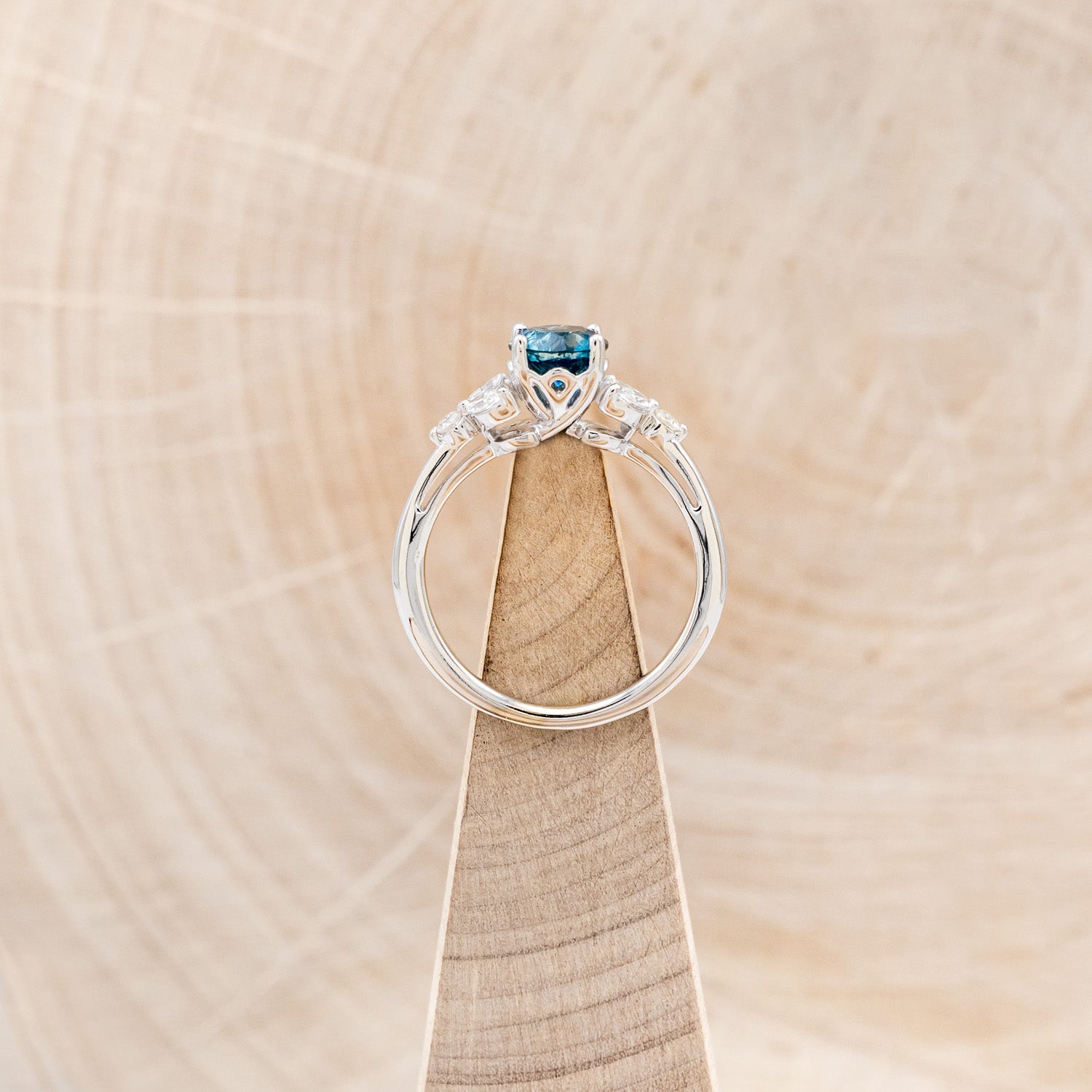 "BLOSSOM" - ROUND CUT MONTANA SAPPHIRE ENGAGEMENT RING WITH LEAF-SHAPED DIAMOND ACCENTS-12