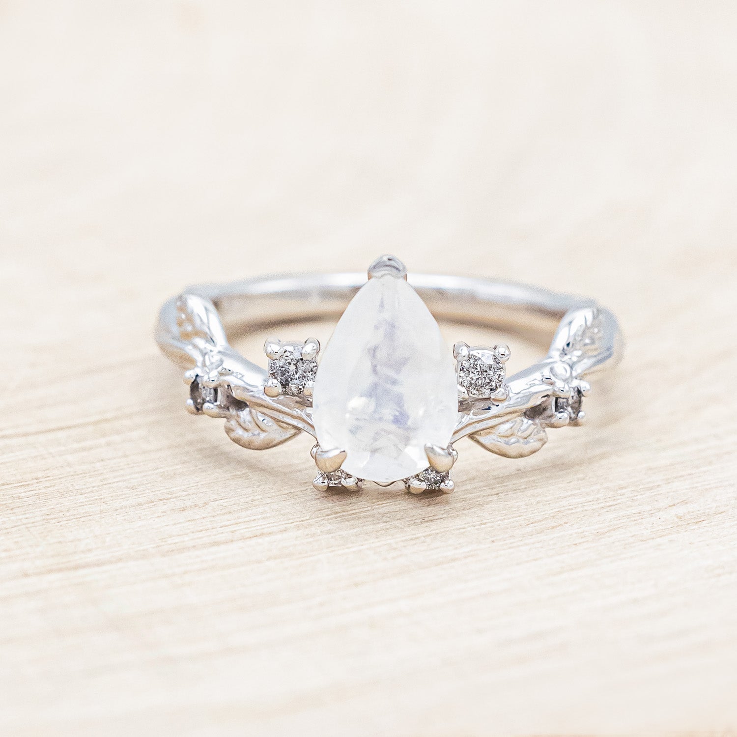 "Harlow" - moonstone women's engagement ring with salt & pepper diamond accents on a branch-inspired band