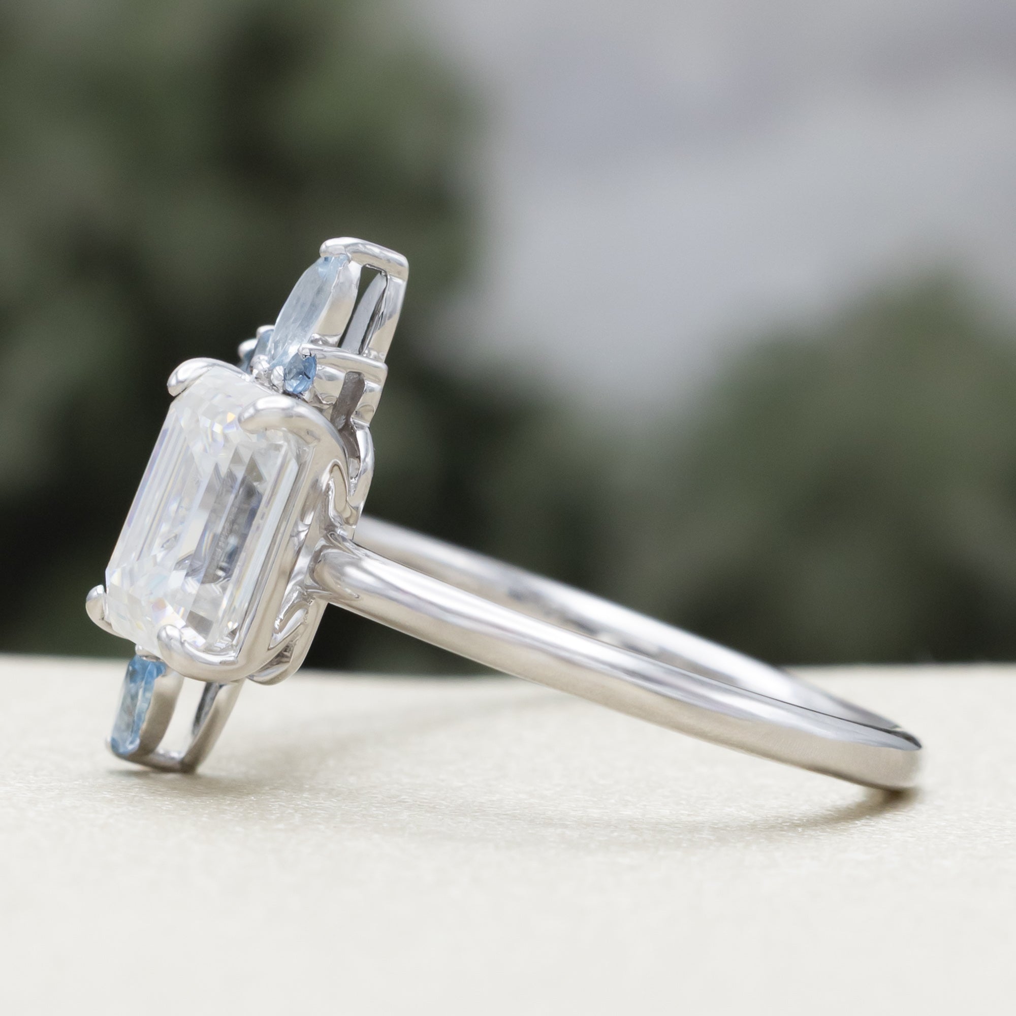 "ISABELLA" - EMERALD CUT MOISSANITE ENGAGEMENT RING WITH AQUAMARINE ACCENTS-Staghead Designs