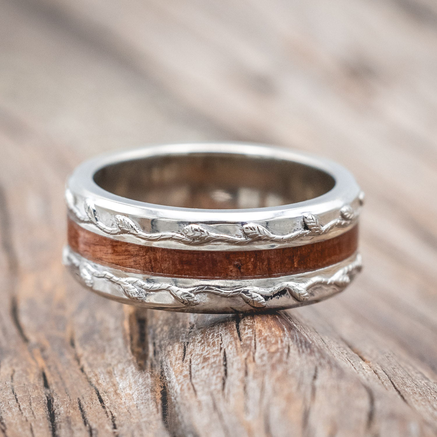 "Nirvana" men's wedding ring with centered redwood inlay and embossed vine in 14K white gold