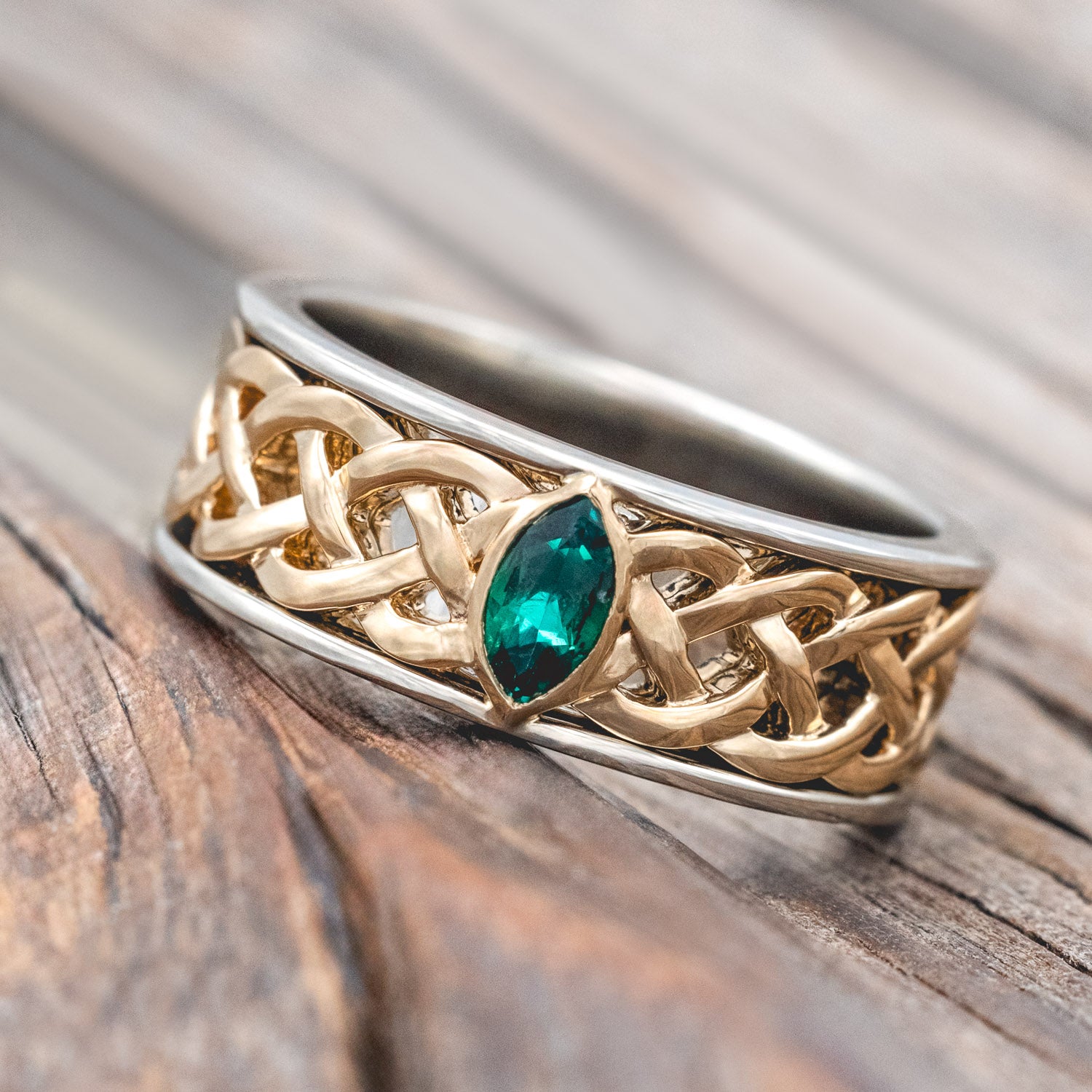 "Oberon" - two-toned men's wedding ring with Celtic knot filigree and lab-grown emerald accent