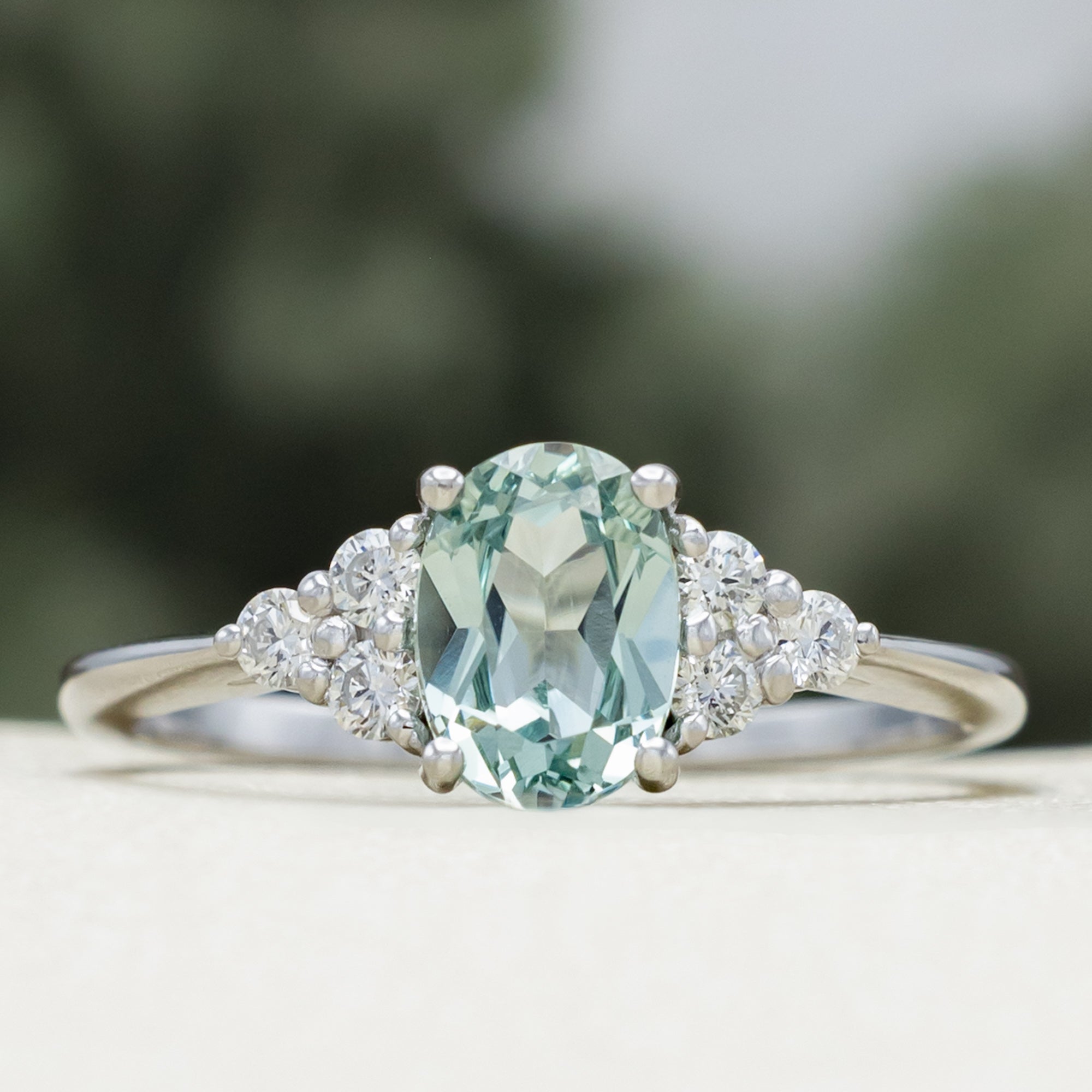 "RHEA" - OVAL CUT LAB-GROWN GREEN SAPPHIRE ENGAGEMENT RING WITH DIAMOND ACCENTS-Staghead Designs