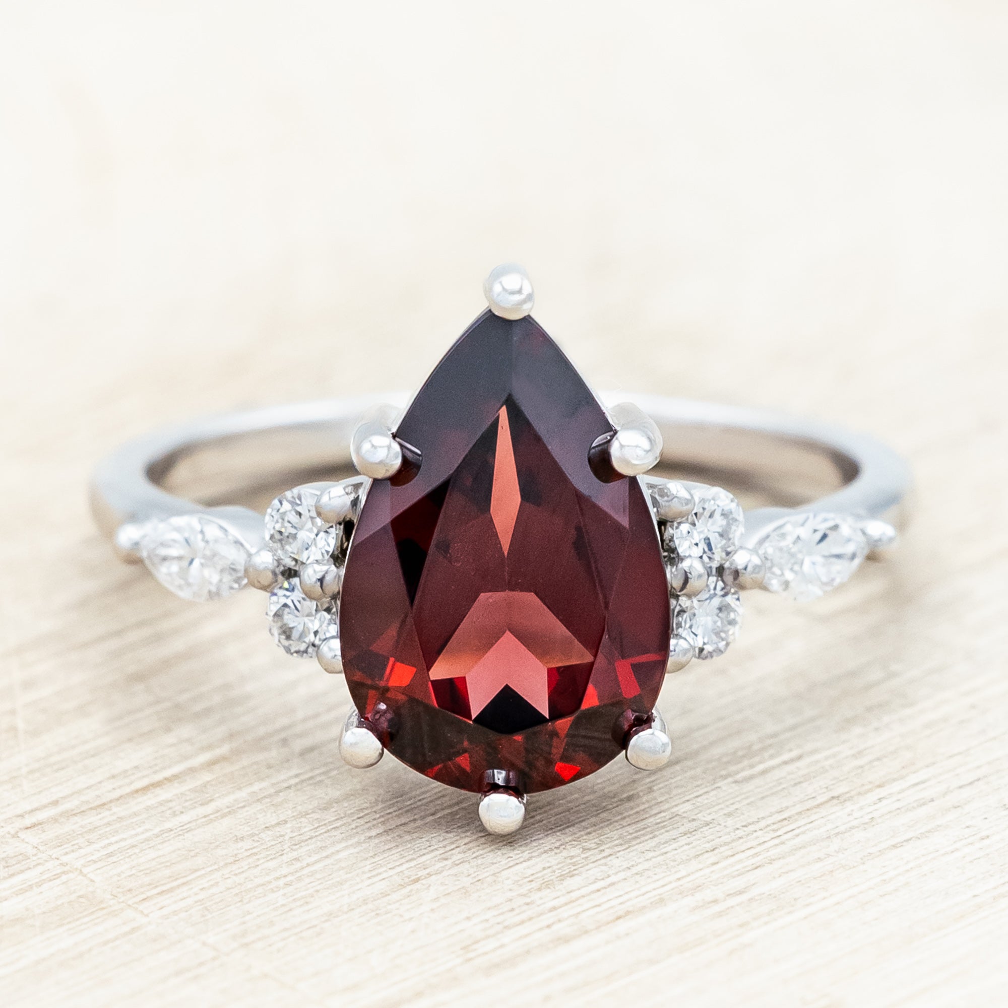 "SAGE" - PEAR CUT MOZAMBIQUE GARNET ENGAGEMENT RING WITH DIAMOND ACCENTS & "FALA" TRACER-Staghead Designs