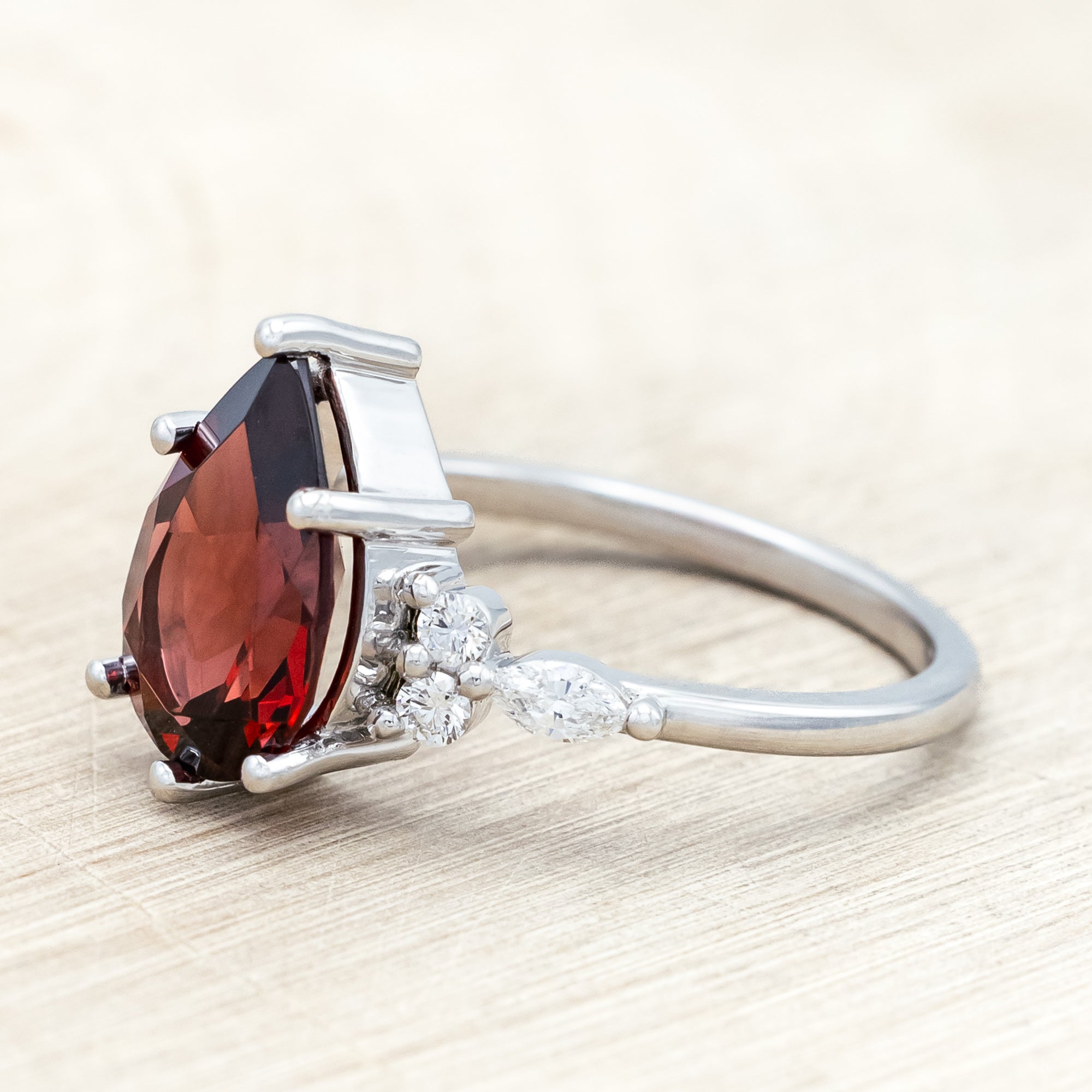 "SAGE" - PEAR CUT MOZAMBIQUE GARNET ENGAGEMENT RING WITH DIAMOND ACCENTS & "FALA" TRACER-Staghead Designs