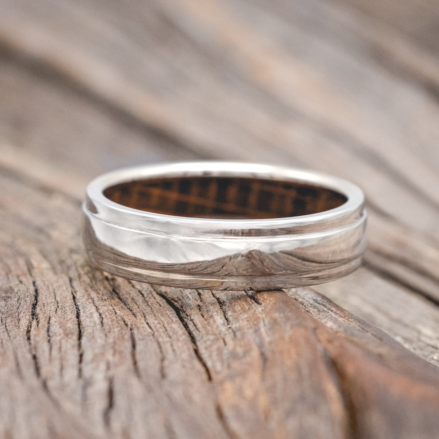 "SEDONA" - RAISED CENTER WEDDING RING FEATURING A WHISKEY BARREL LINED 14K GOLD BAND-Staghead Designs